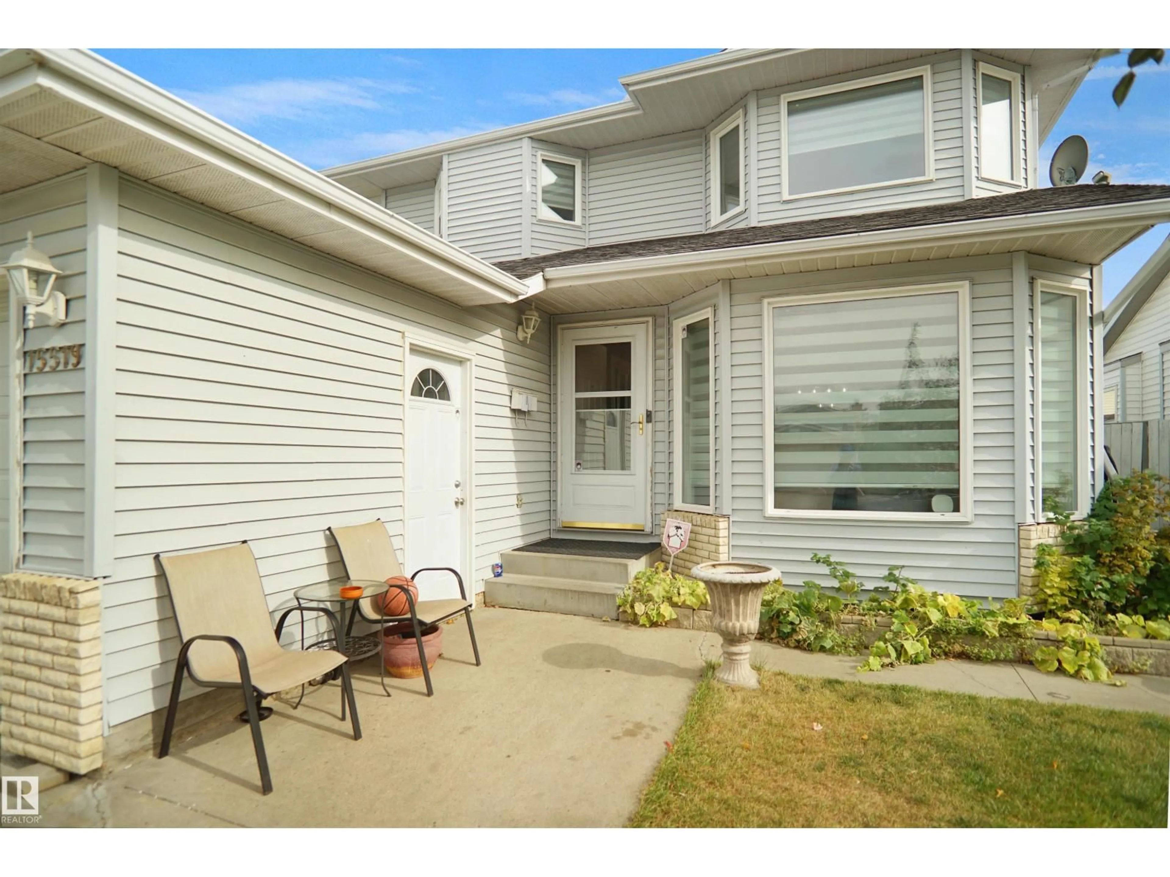 Home with vinyl exterior material, street for 15519 70 ST, Edmonton Alberta T5Z2Y6