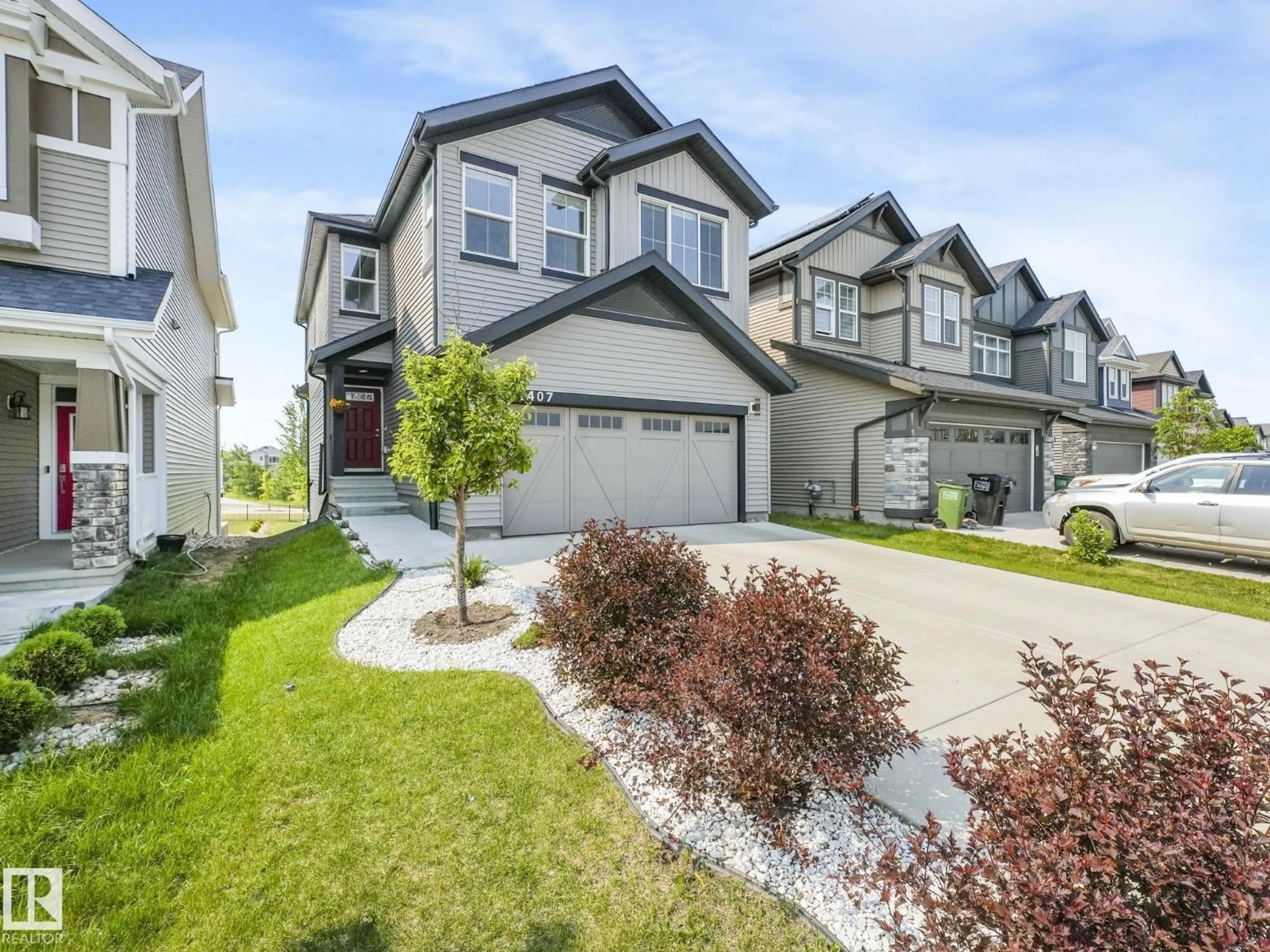 Home with vinyl exterior material, street for 1407 DARBY GREEN GR, Edmonton Alberta T6W4N4