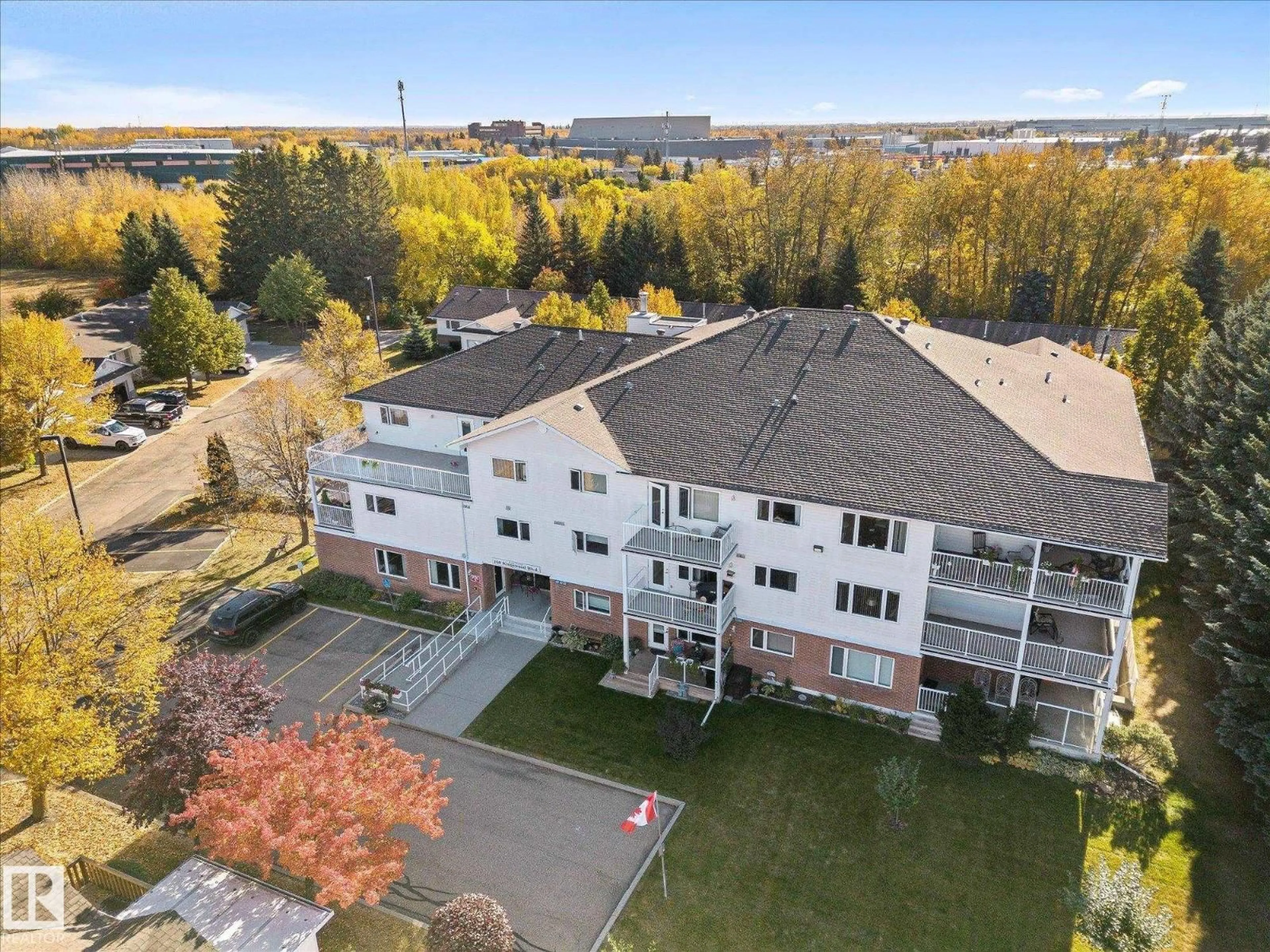 A pic from outside/outdoor area/front of a property/back of a property/a pic from drone, unknown for #203 - 160 KINGSWOOD BV, St. Albert Alberta T8N6Z2