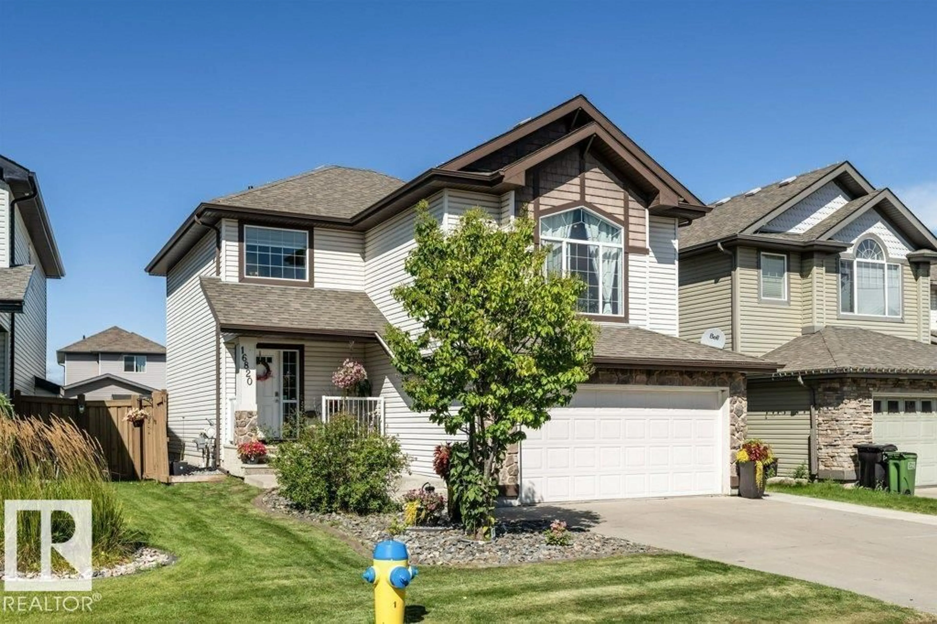 Home with vinyl exterior material, street for 16820 57 ST, Edmonton Alberta T5Y0K4