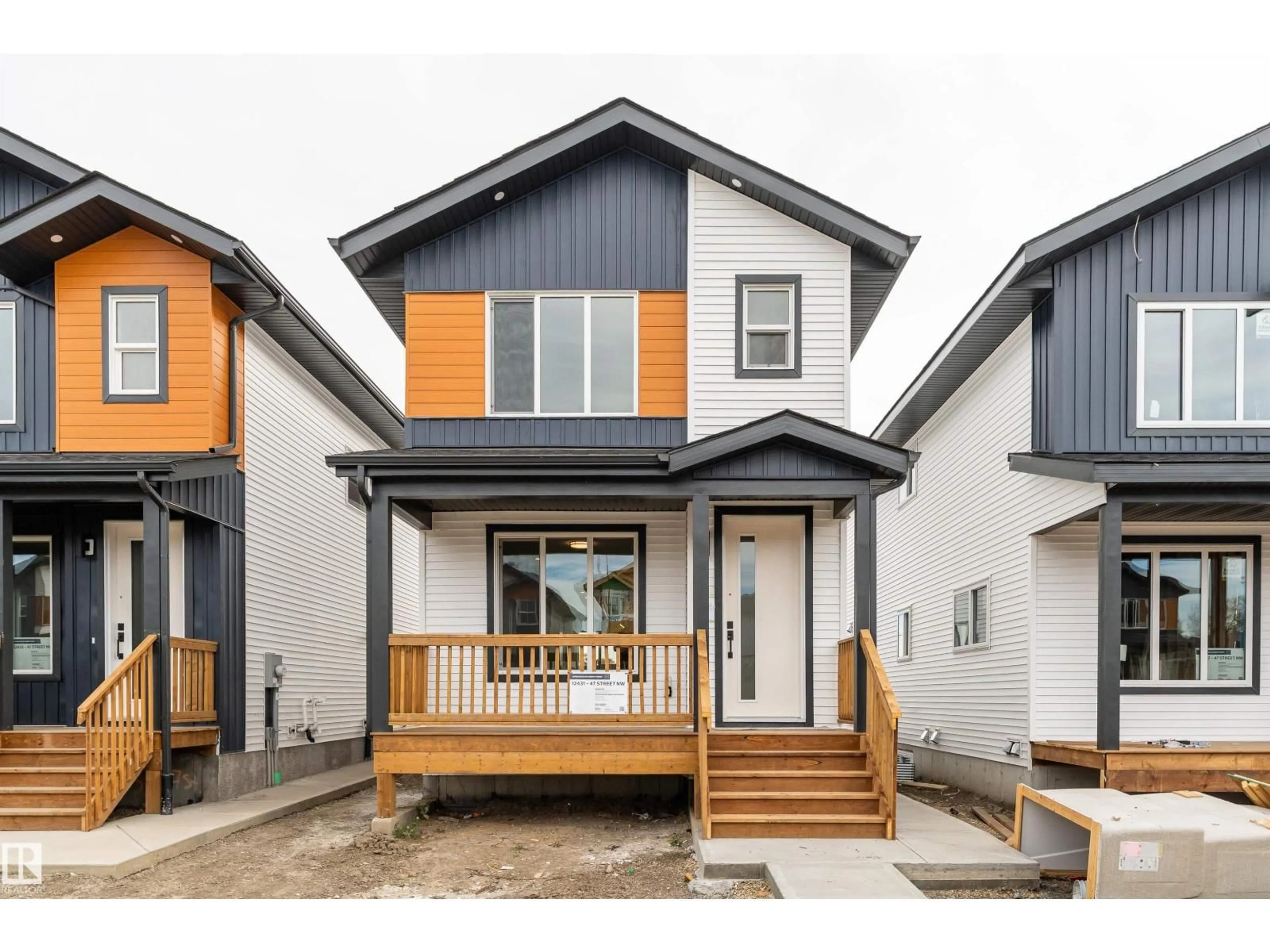 Home with vinyl exterior material, street for 12431 47 ST, Edmonton Alberta T5W5E5