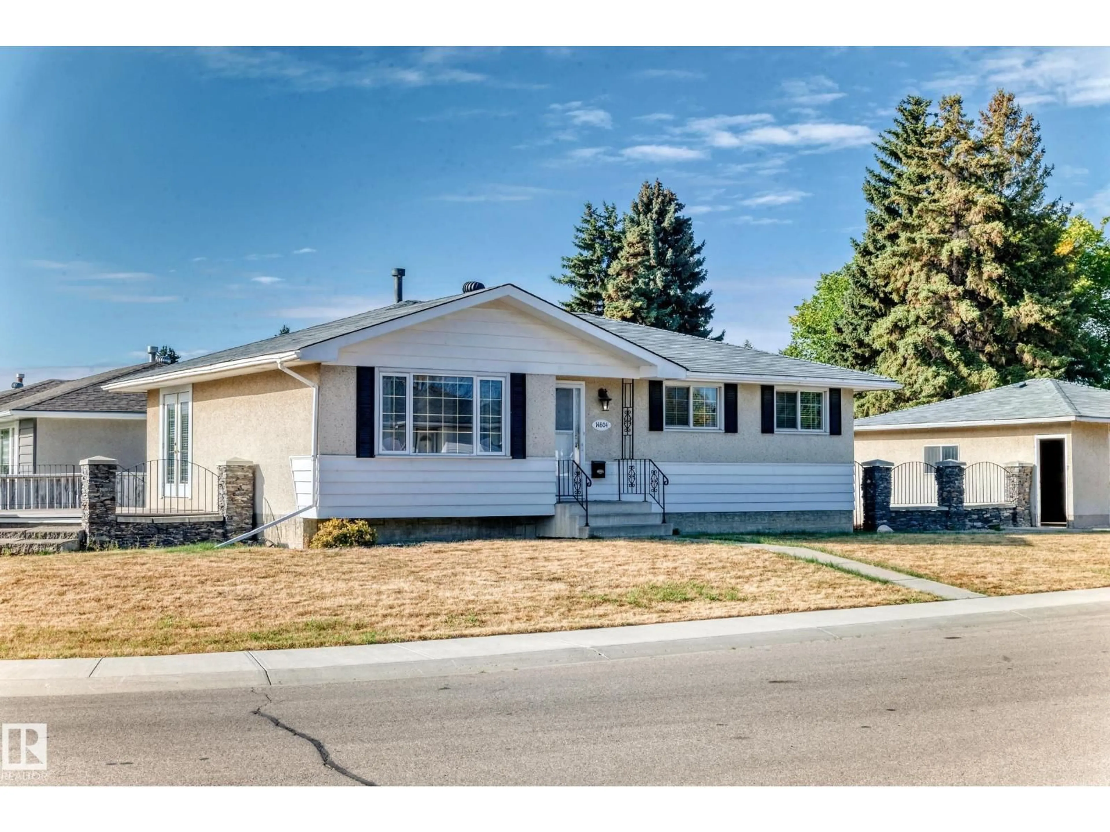 Home with vinyl exterior material, street for 14804 73A ST NW, Edmonton Alberta T5C0W4