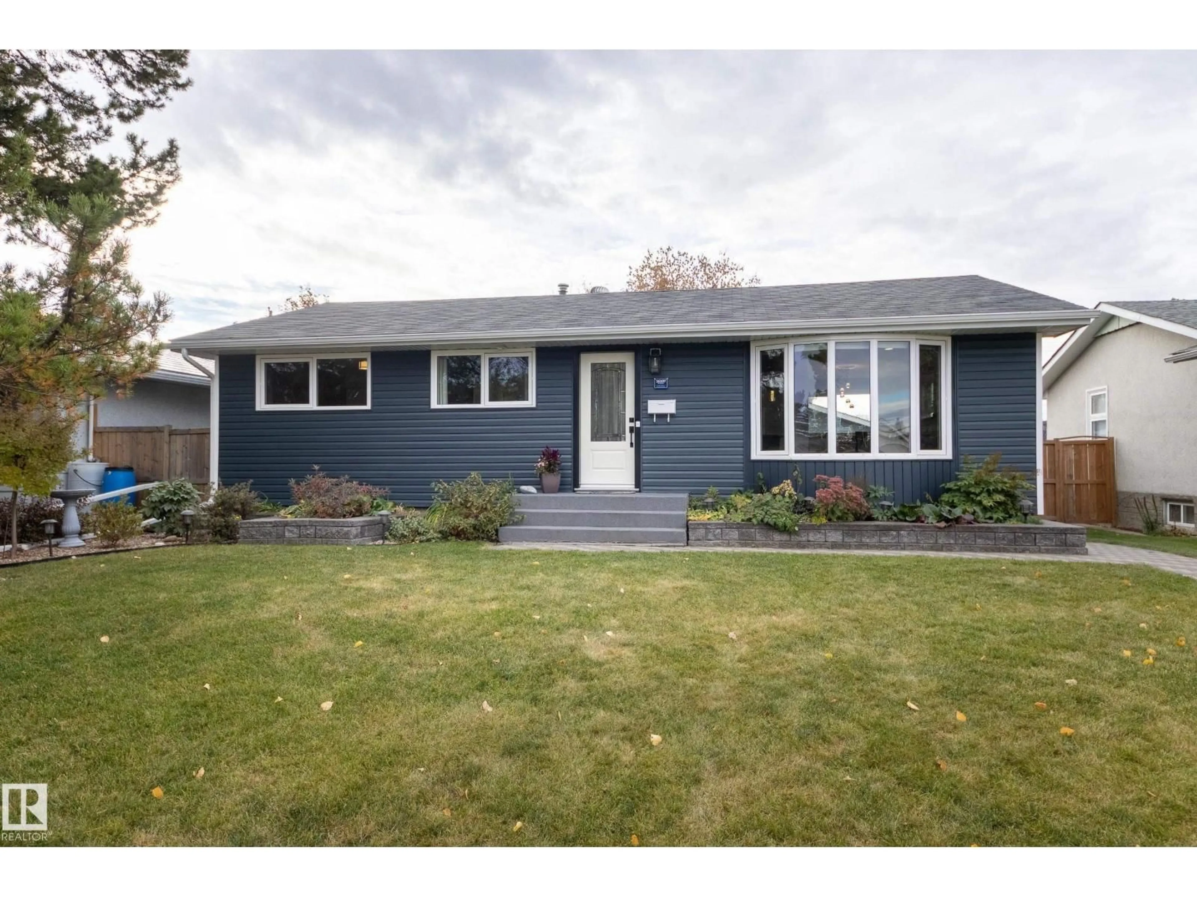 Home with vinyl exterior material, street for 16107 80 AV, Edmonton Alberta T5R3M5