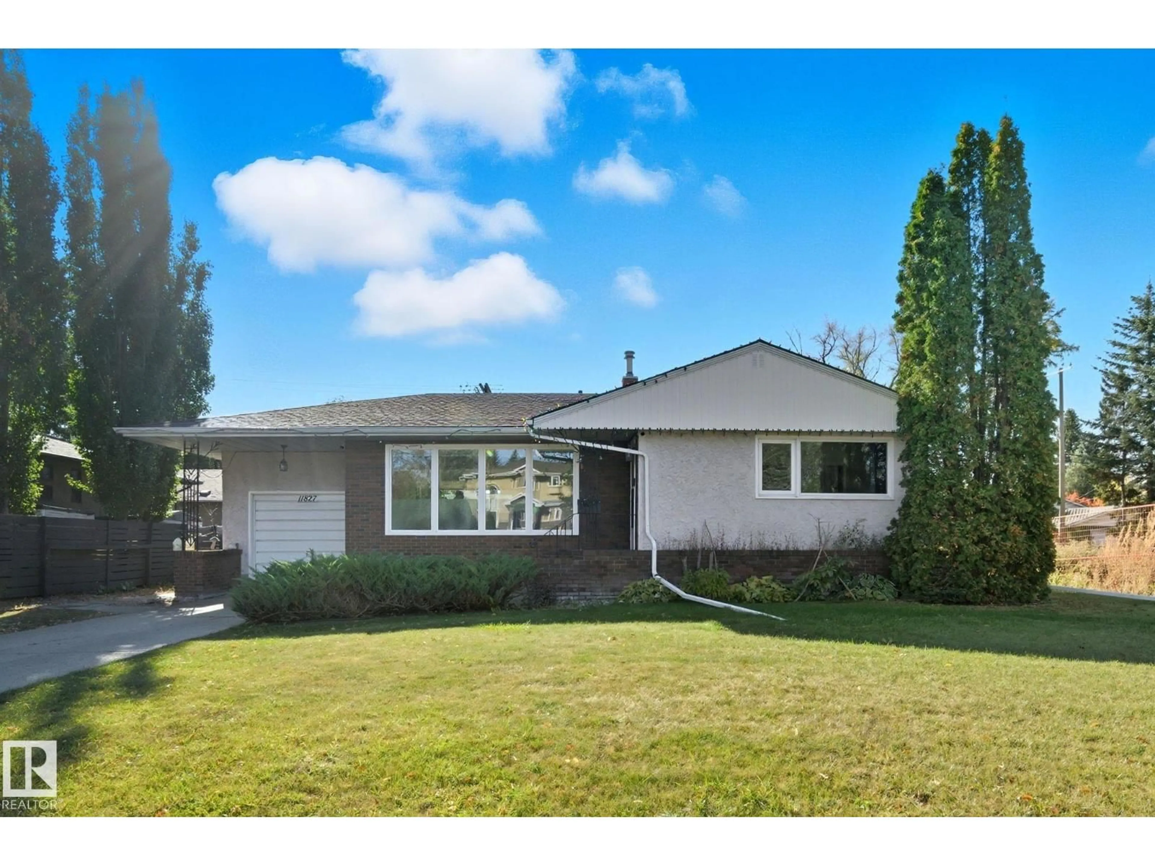 Home with vinyl exterior material, street for 11827 87 AV, Edmonton Alberta T6G0Y5