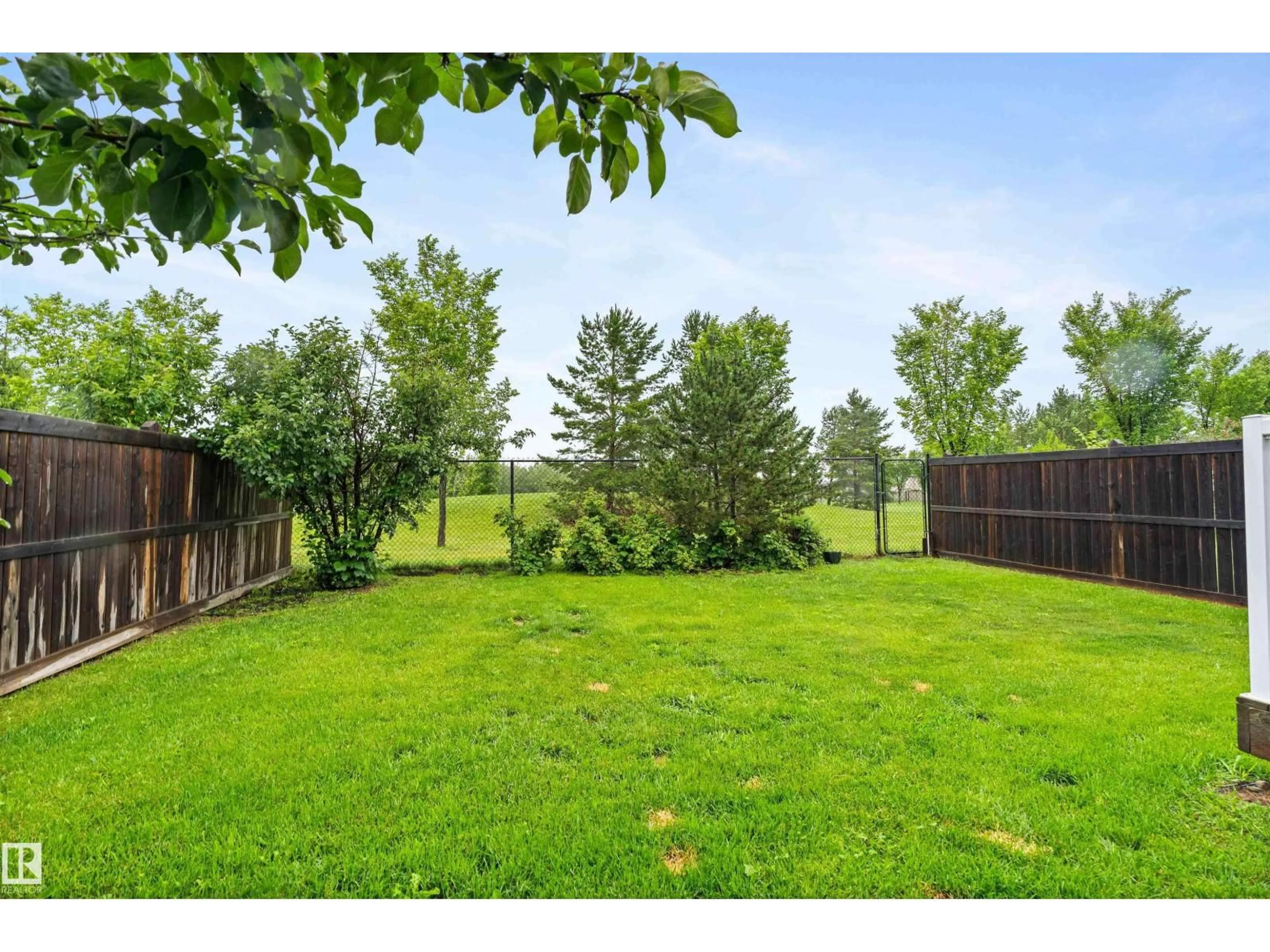 A pic from outside/outdoor area/front of a property/back of a property/a pic from drone, forest/trees view for 7918 7 AV, Edmonton Alberta T6X1N3