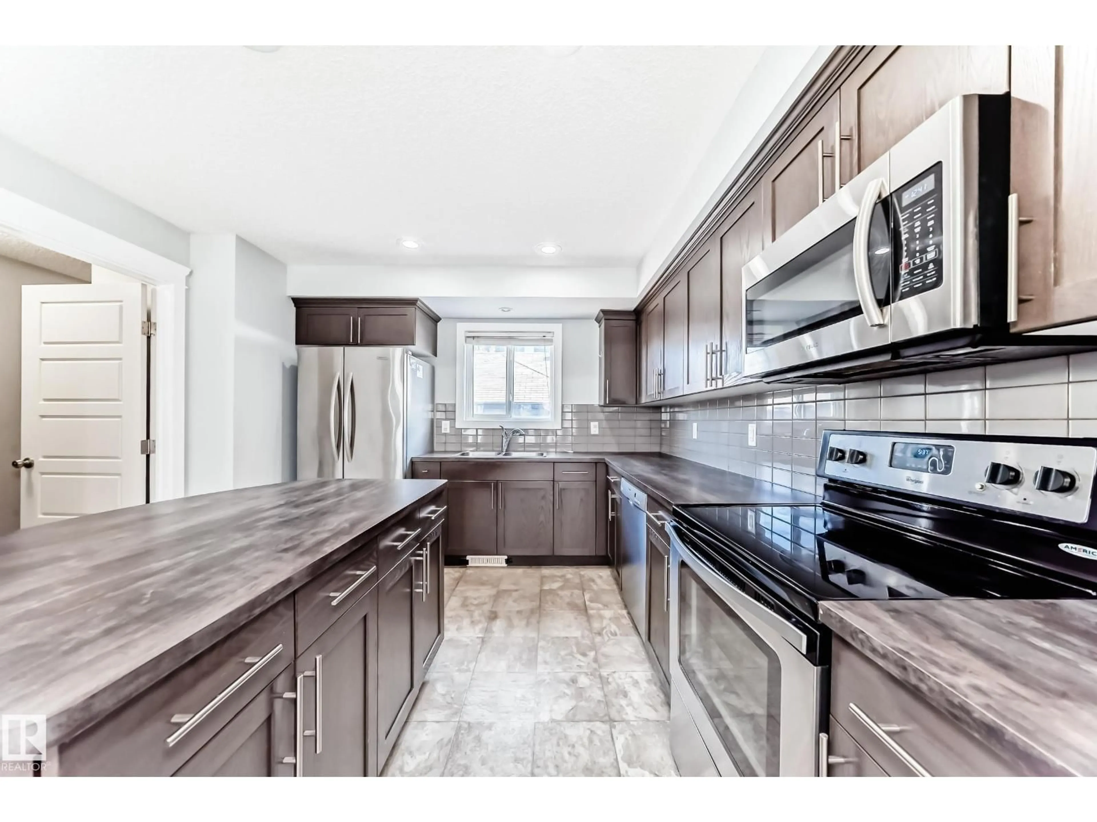 Open concept kitchen, ceramic/tile floor for SW - 1611 52 ST, Edmonton Alberta T6X1X9
