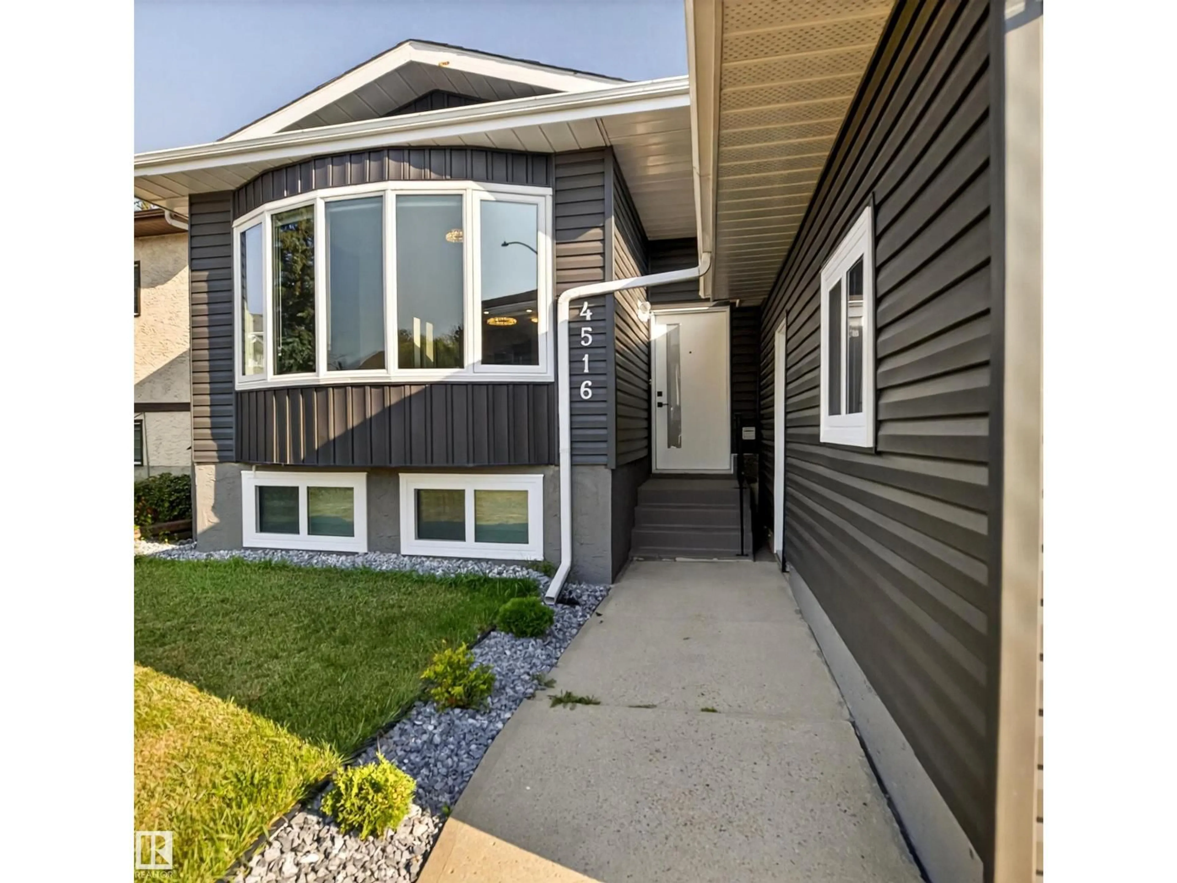 Home with vinyl exterior material, street for 4516 27 AV, Edmonton Alberta T6L4P9