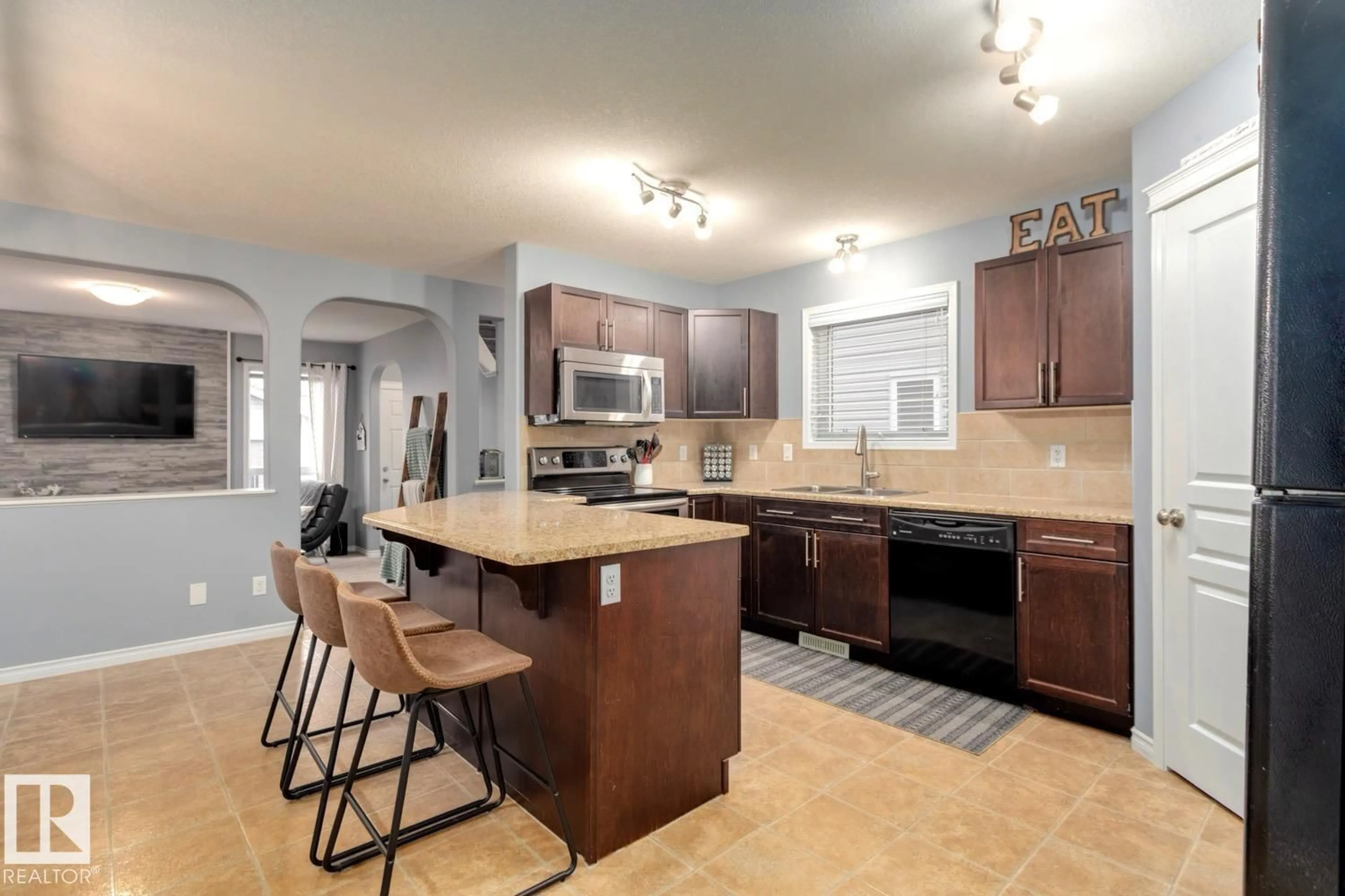 Open concept kitchen, ceramic/tile floor for NW - 21212 58 AV, Edmonton Alberta T6M0H3