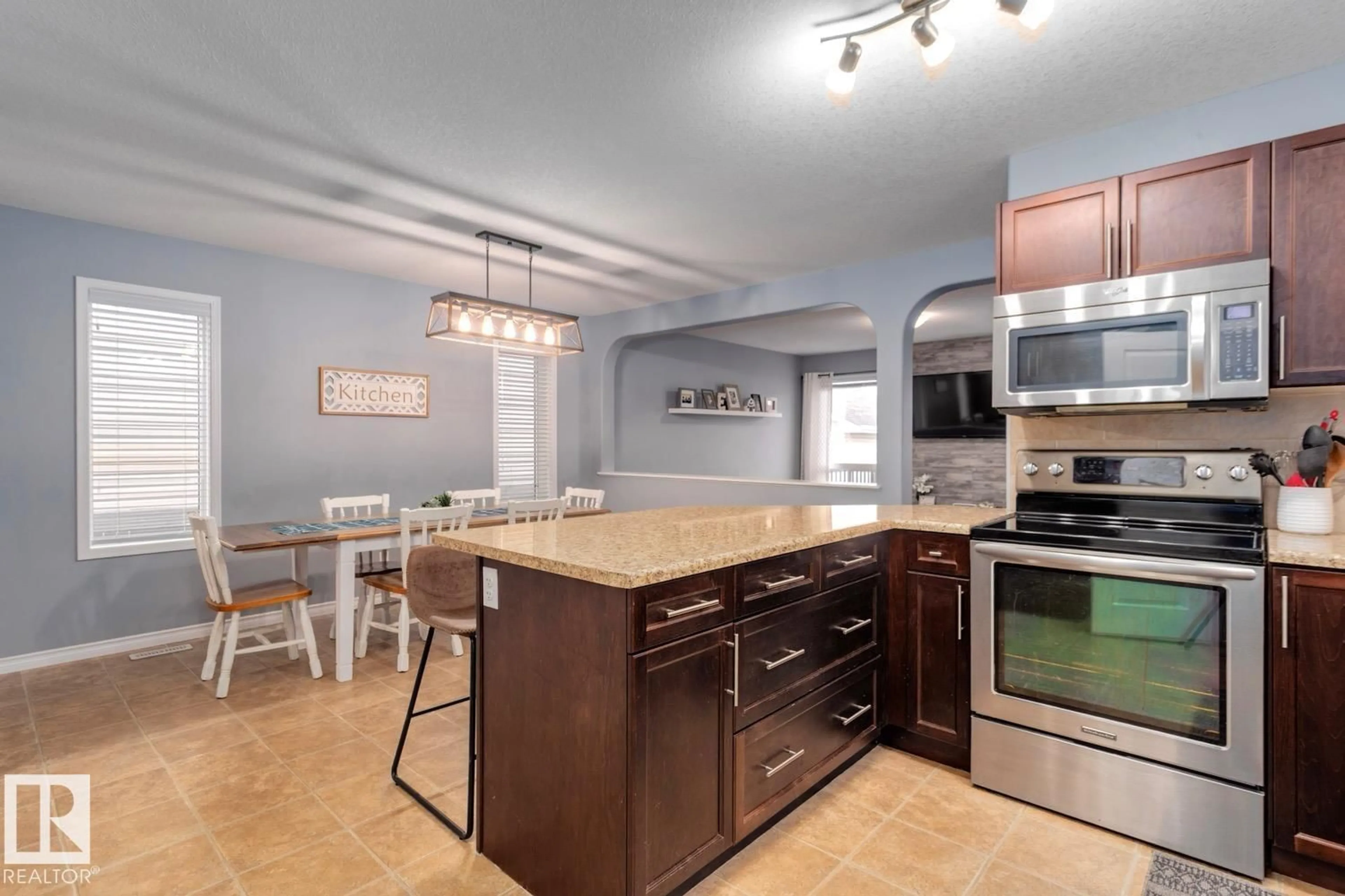 Open concept kitchen, ceramic/tile floor for NW - 21212 58 AV, Edmonton Alberta T6M0H3