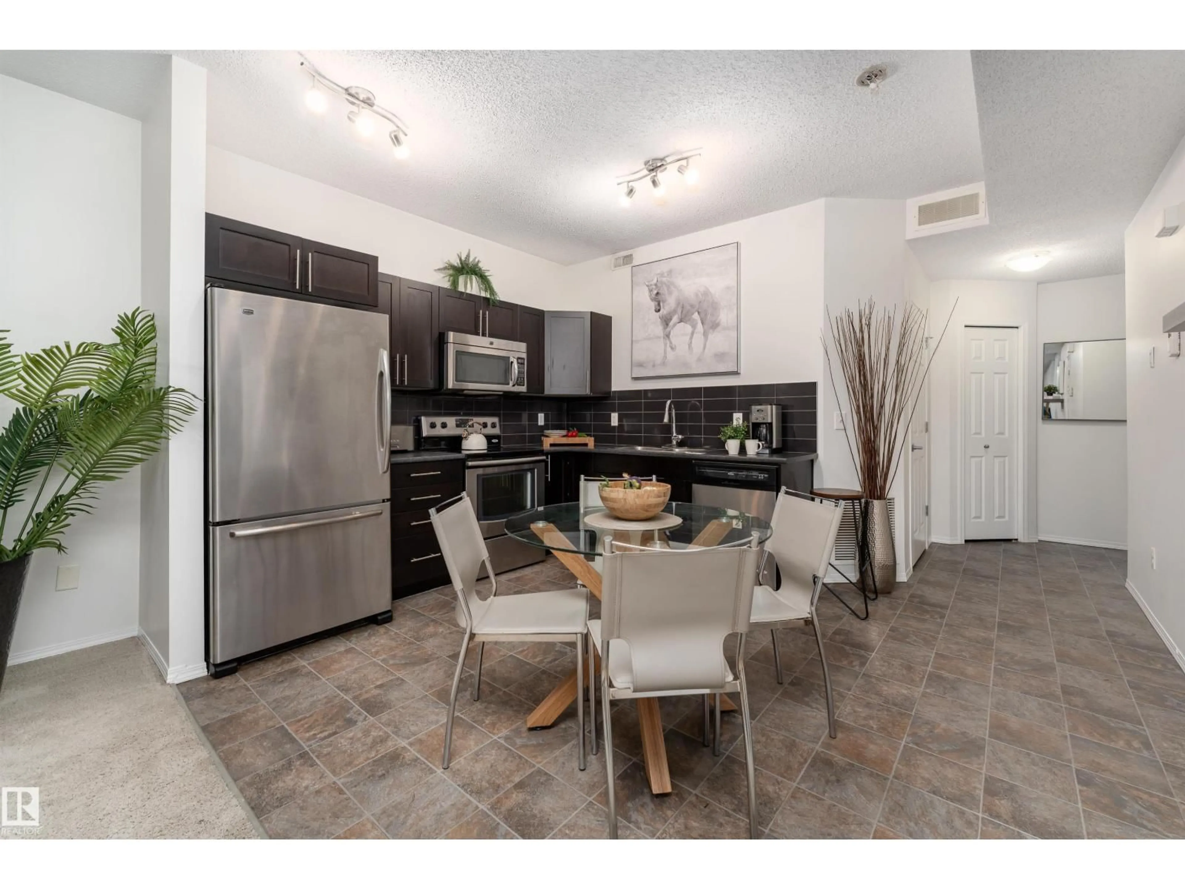 Open concept kitchen, ceramic/tile floor for 22 6520 2 AV SW, Edmonton Alberta T6X1S4