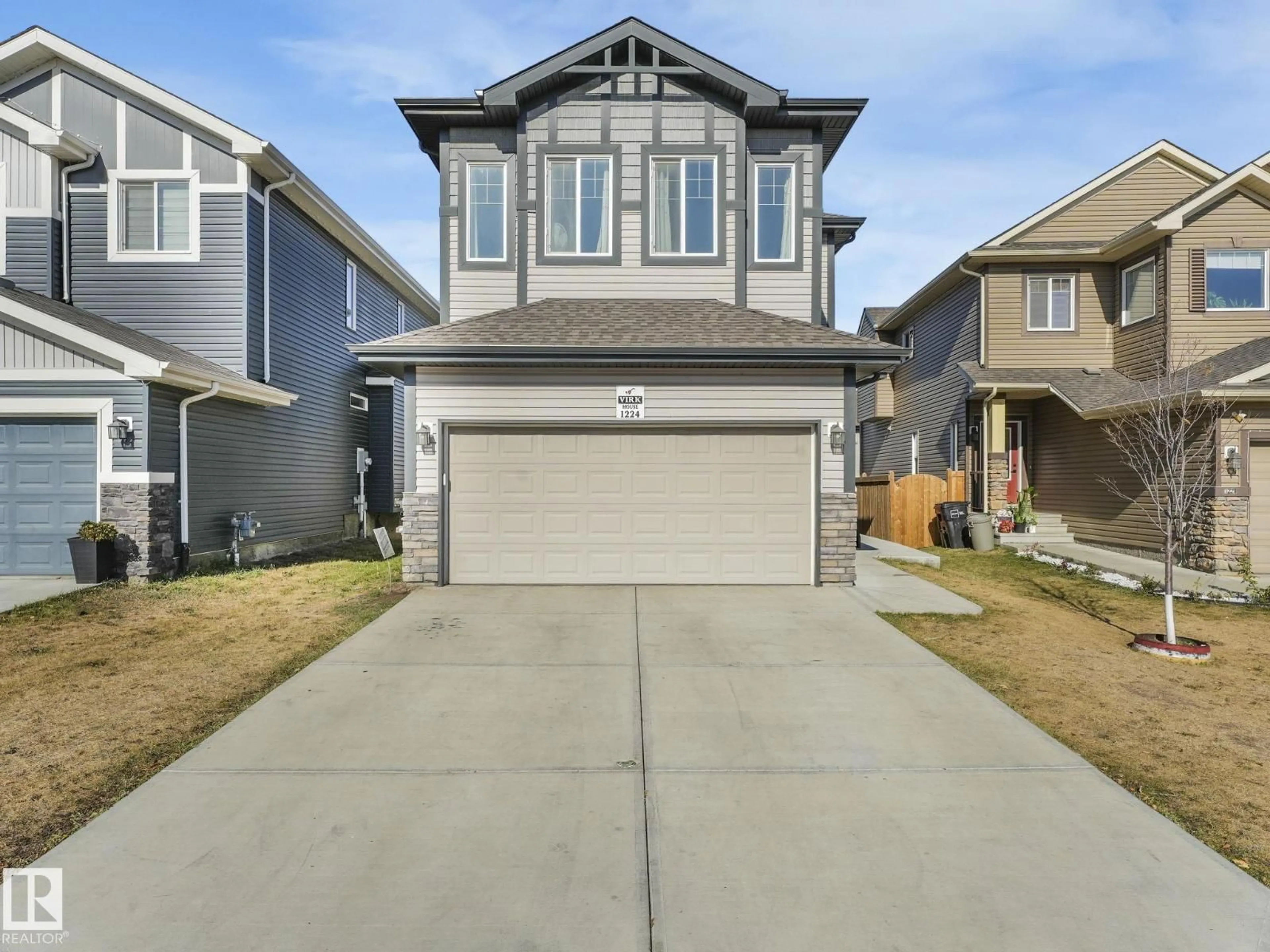 Home with vinyl exterior material, street for NW - 1224 25 AV, Edmonton Alberta T6T2E5