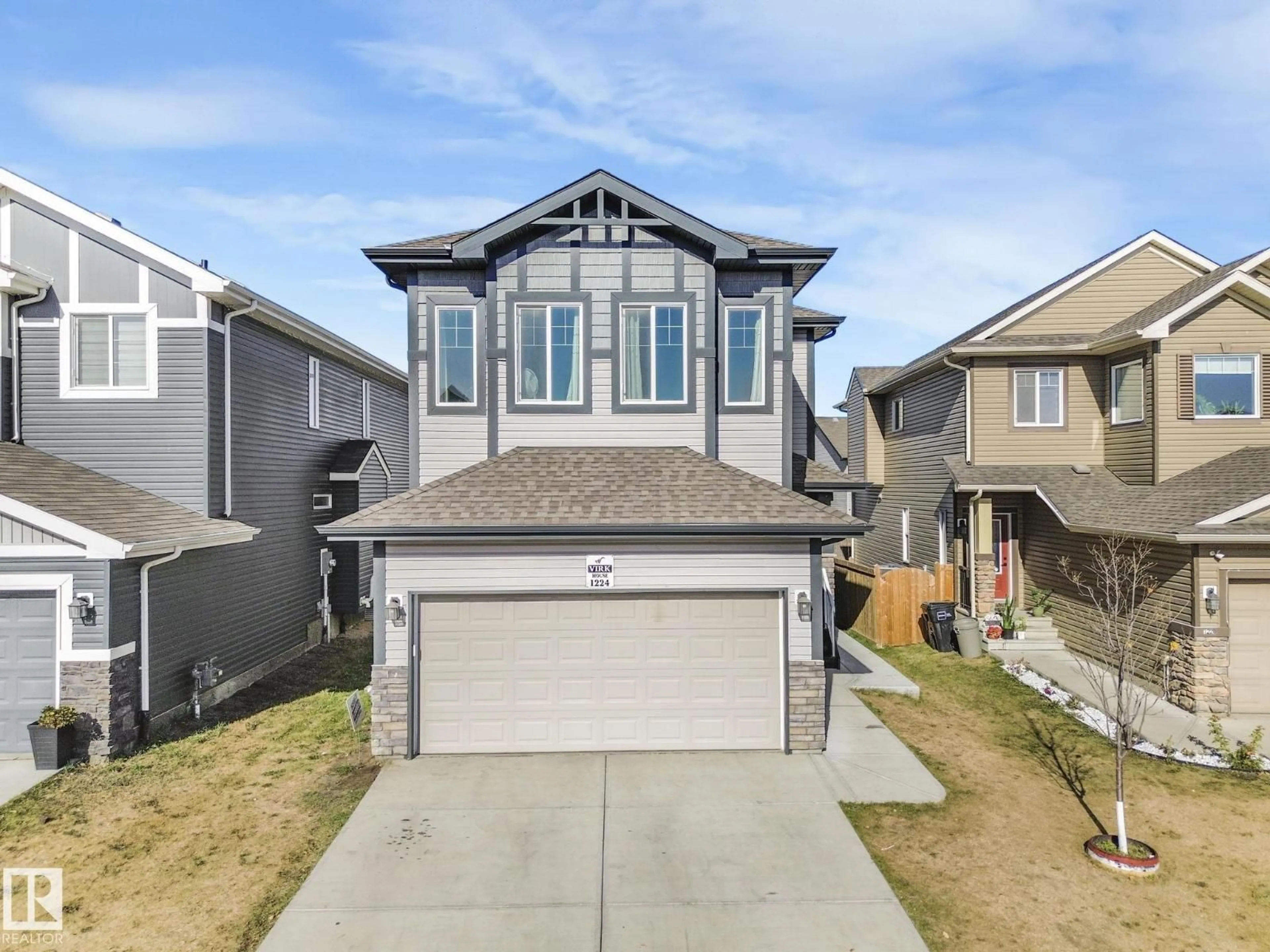 Home with vinyl exterior material, street for NW - 1224 25 AV, Edmonton Alberta T6T2E5