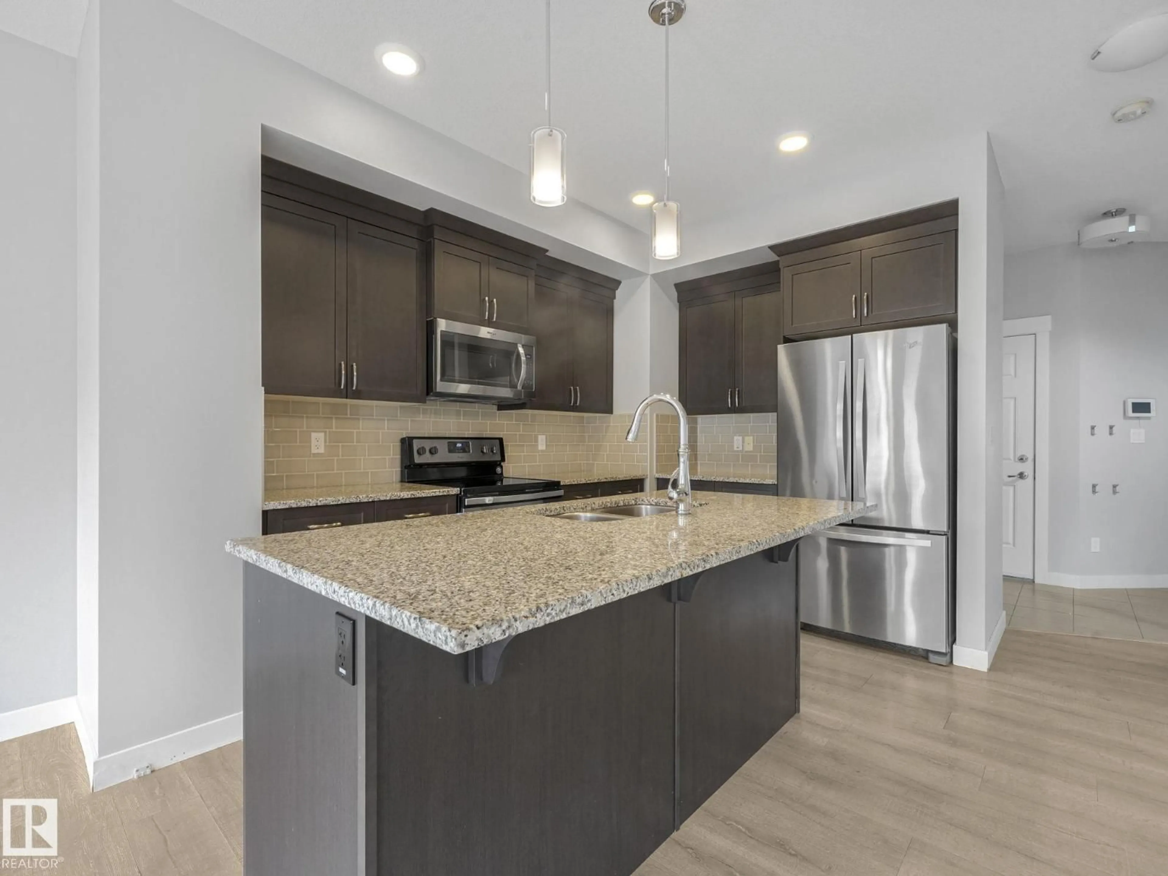 Open concept kitchen, unknown for 557 STURTZ LI, Leduc Alberta T9E1E3
