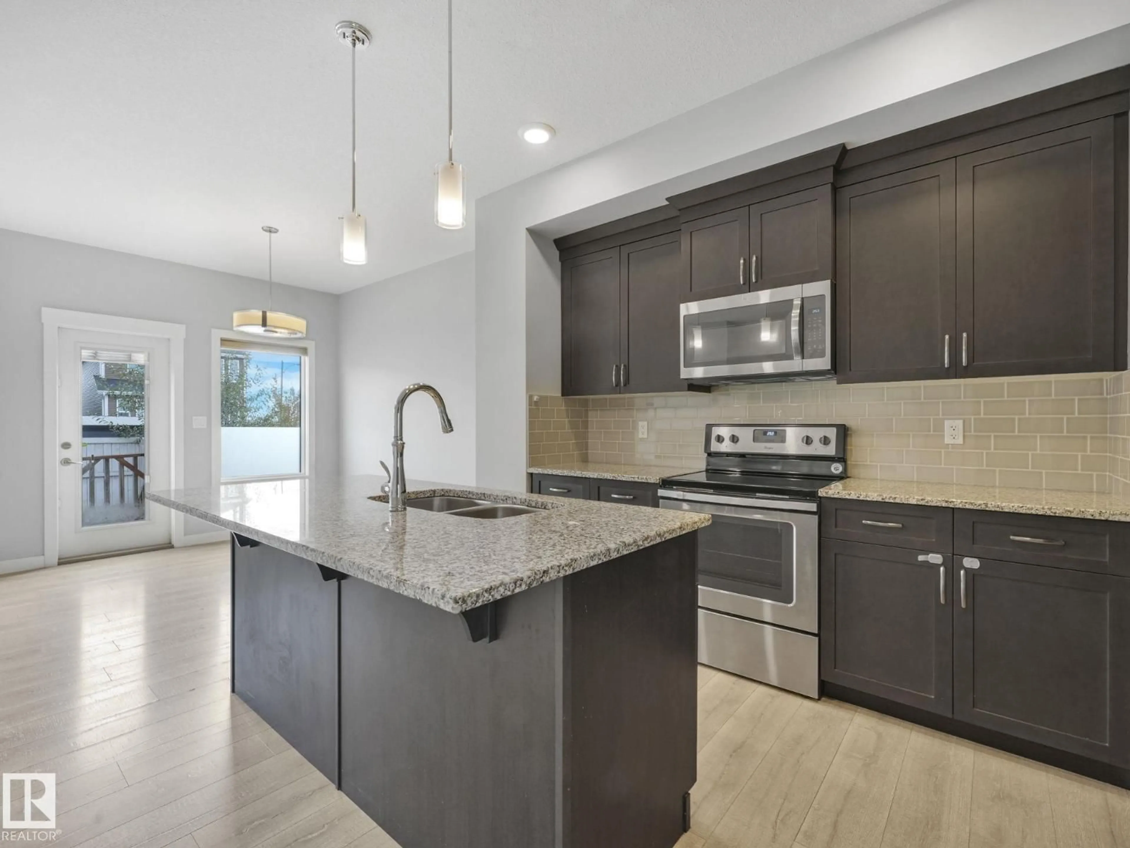 Open concept kitchen, ceramic/tile floor for 557 STURTZ LI, Leduc Alberta T9E1E3