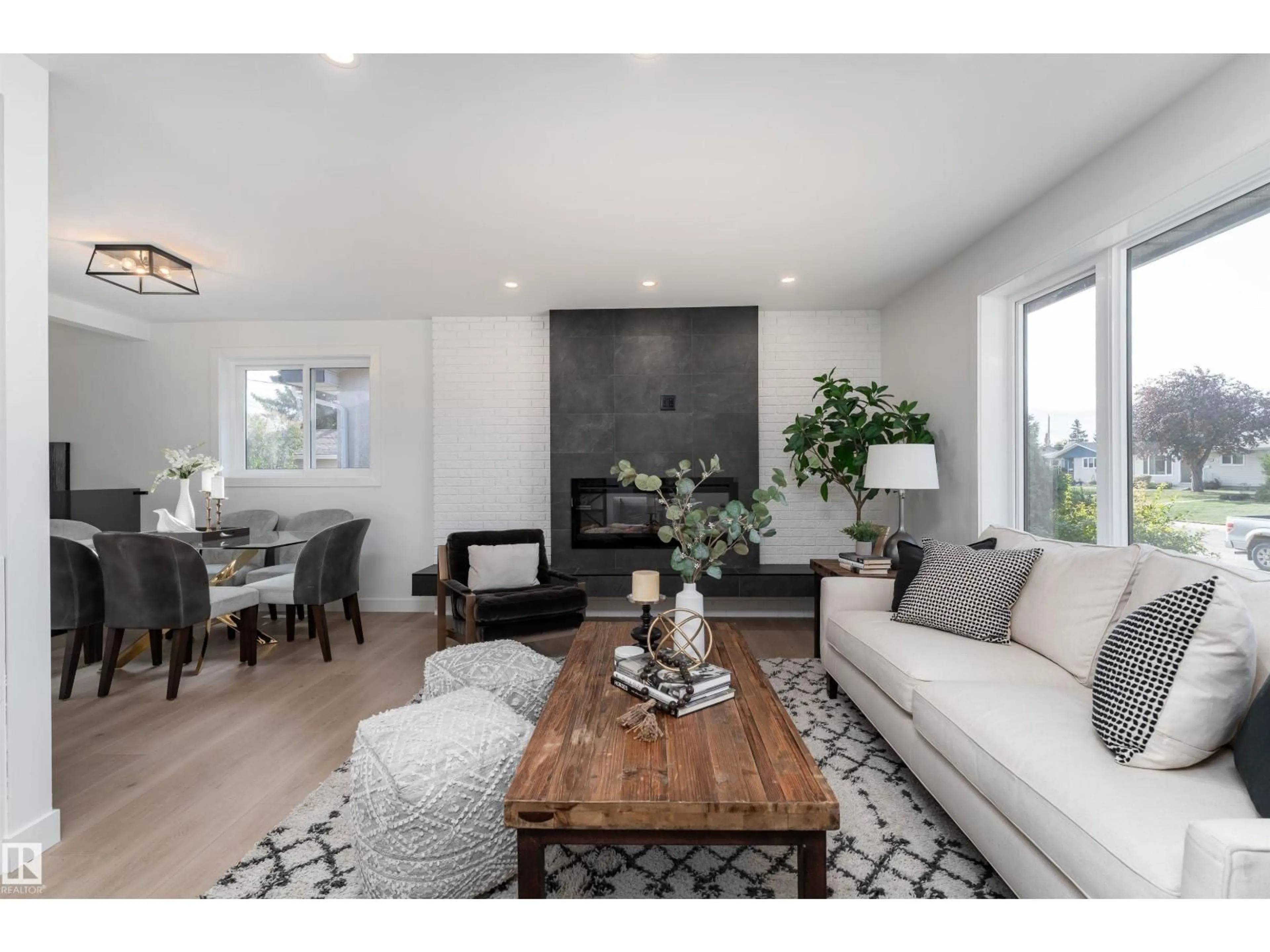 Living room with furniture, wood/laminate floor for NW - 8707 54 ST, Edmonton Alberta T6B1H2