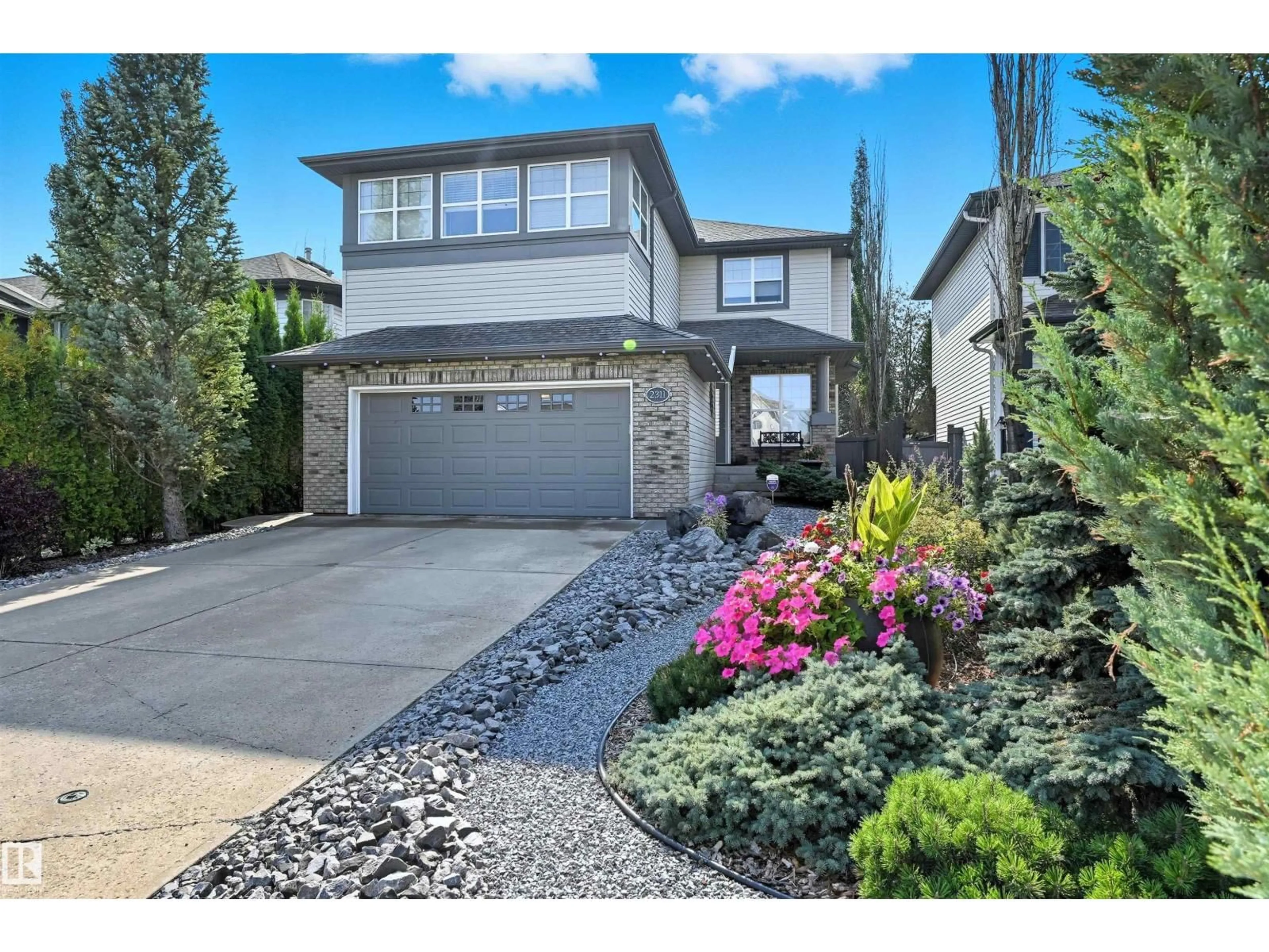 Home with vinyl exterior material, street for 2311 BAILEY CT, Edmonton Alberta T6W1H9
