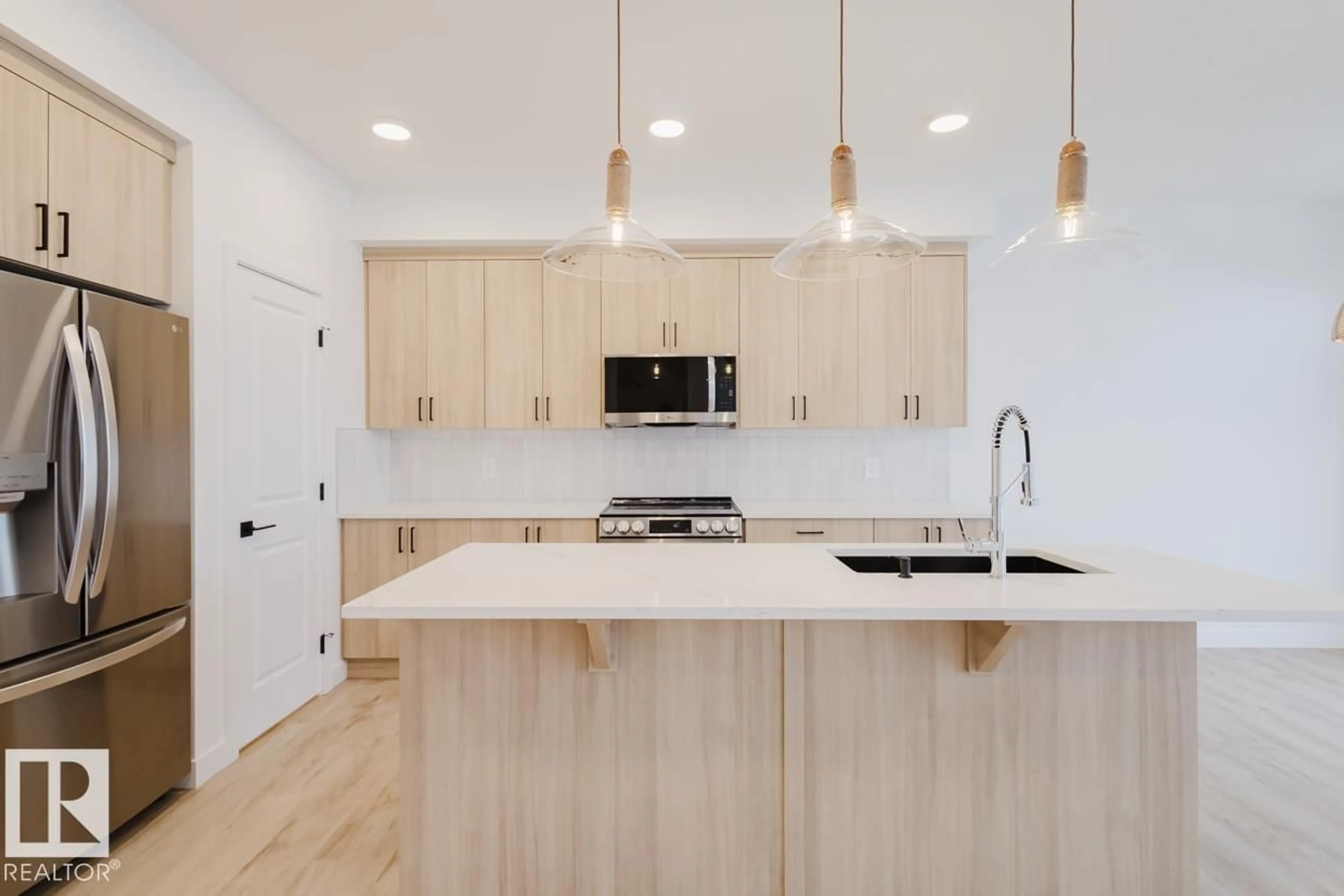 Open concept kitchen, wood/laminate floor for 2130 CROSSBILL LN, Edmonton Alberta T5S0W3