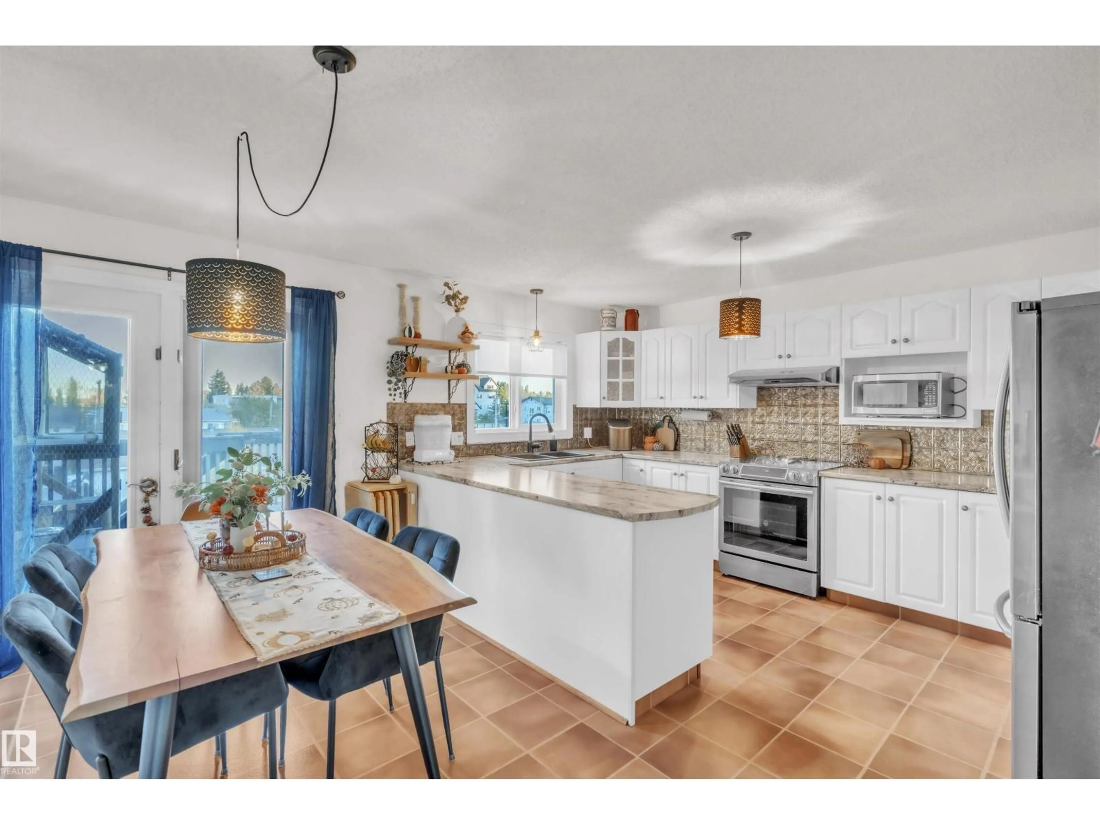 Open concept kitchen, ceramic/tile floor for 922 12 ST, Cold Lake Alberta T9M1K2