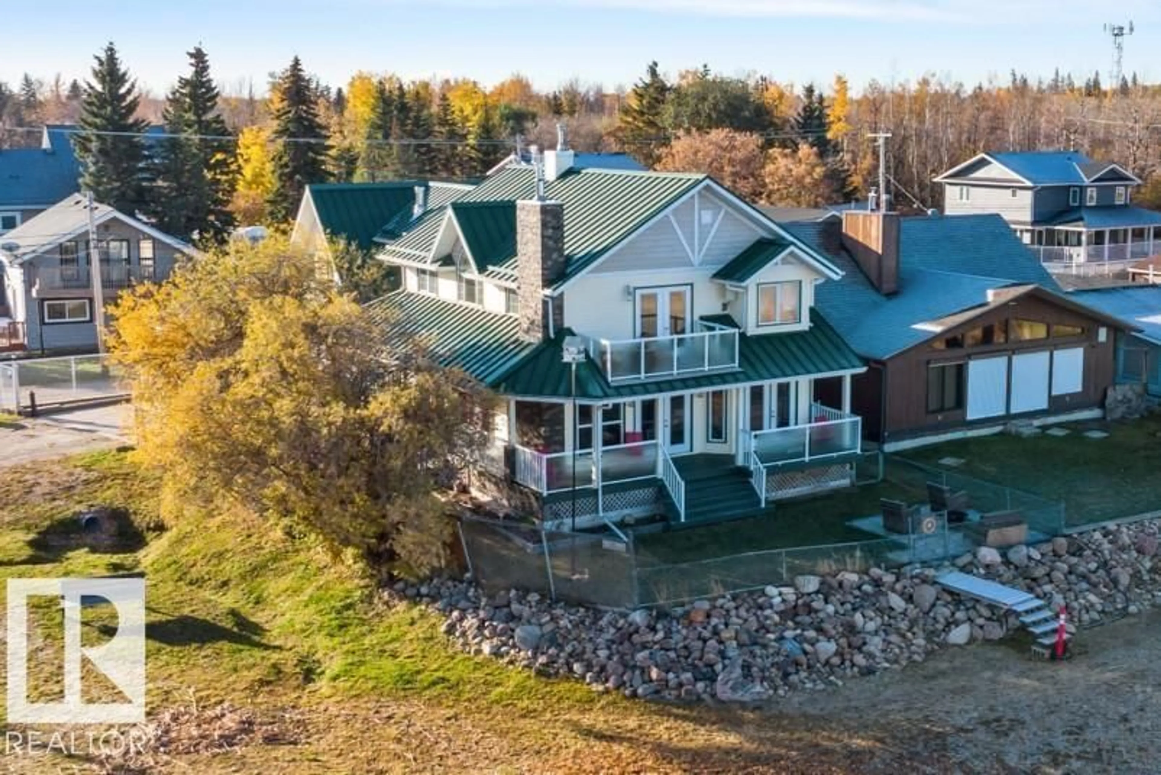 A pic from outside/outdoor area/front of a property/back of a property/a pic from drone, water/lake/river/ocean view for 5803 51 AV, Rural Lac Ste. Anne County Alberta T0E0A0