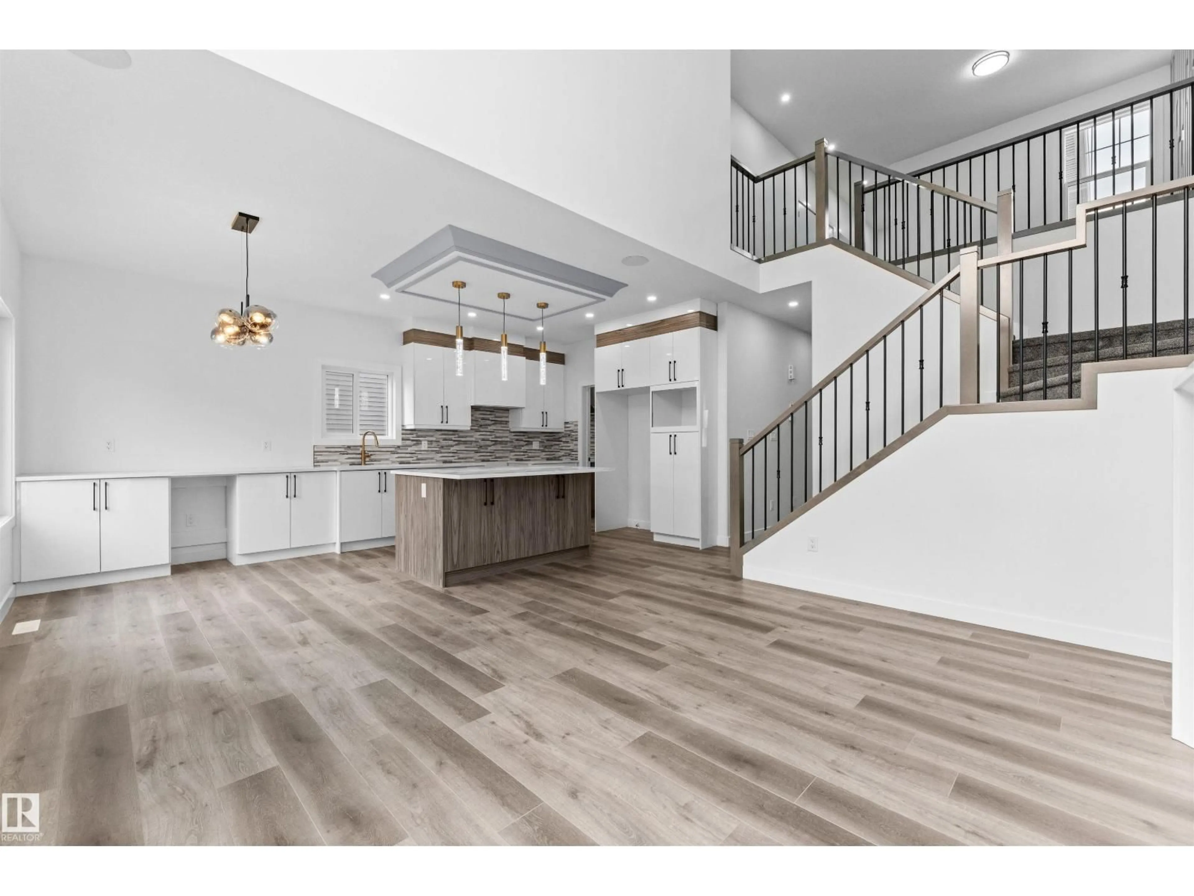 Open concept kitchen, wood/laminate floor for 1727 60 AV, Rural Leduc County Alberta T4X3C5