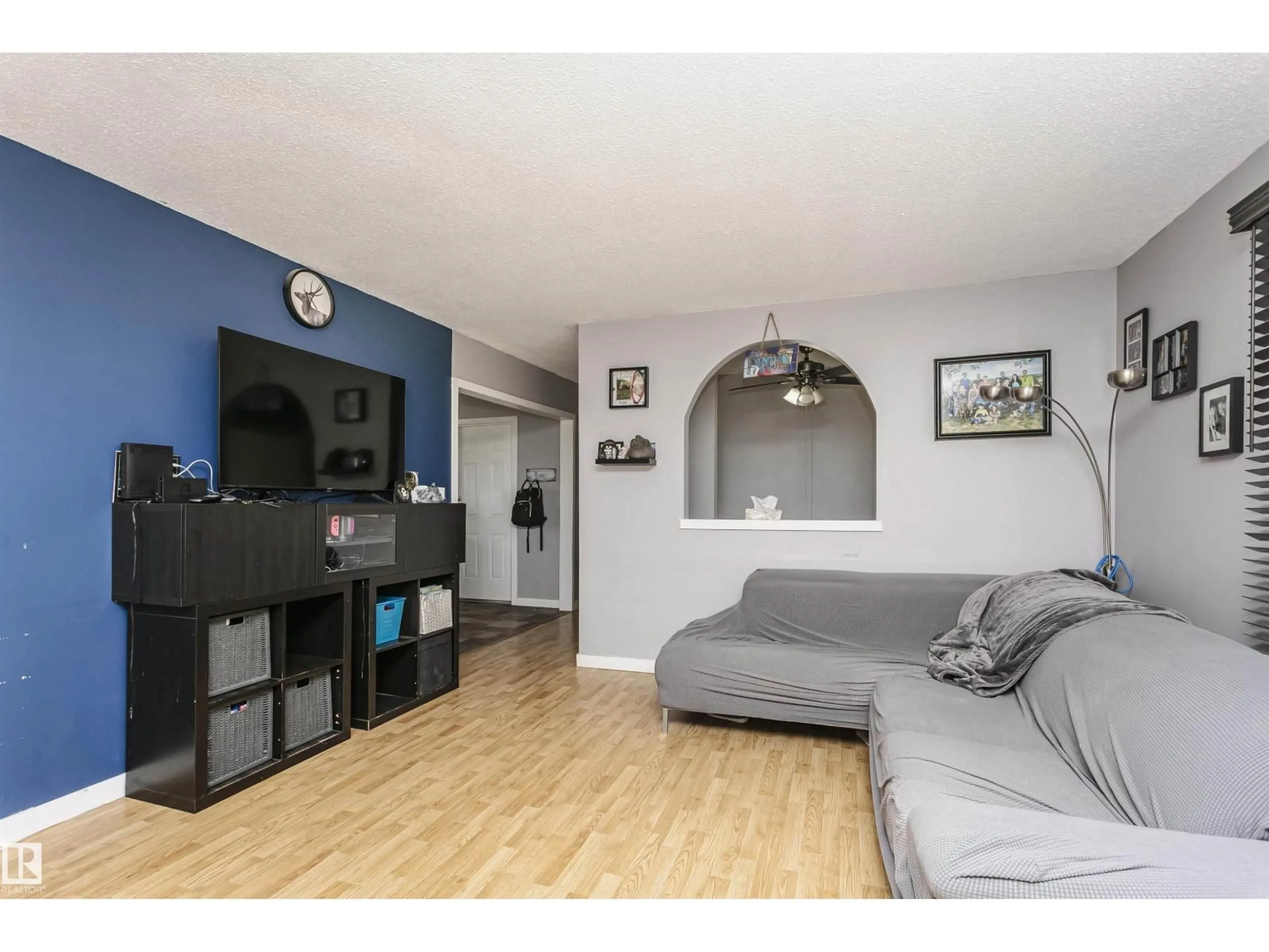 Living room with furniture, wood/laminate floor for 14 WAPITI DR, Devon Alberta T9G1R2