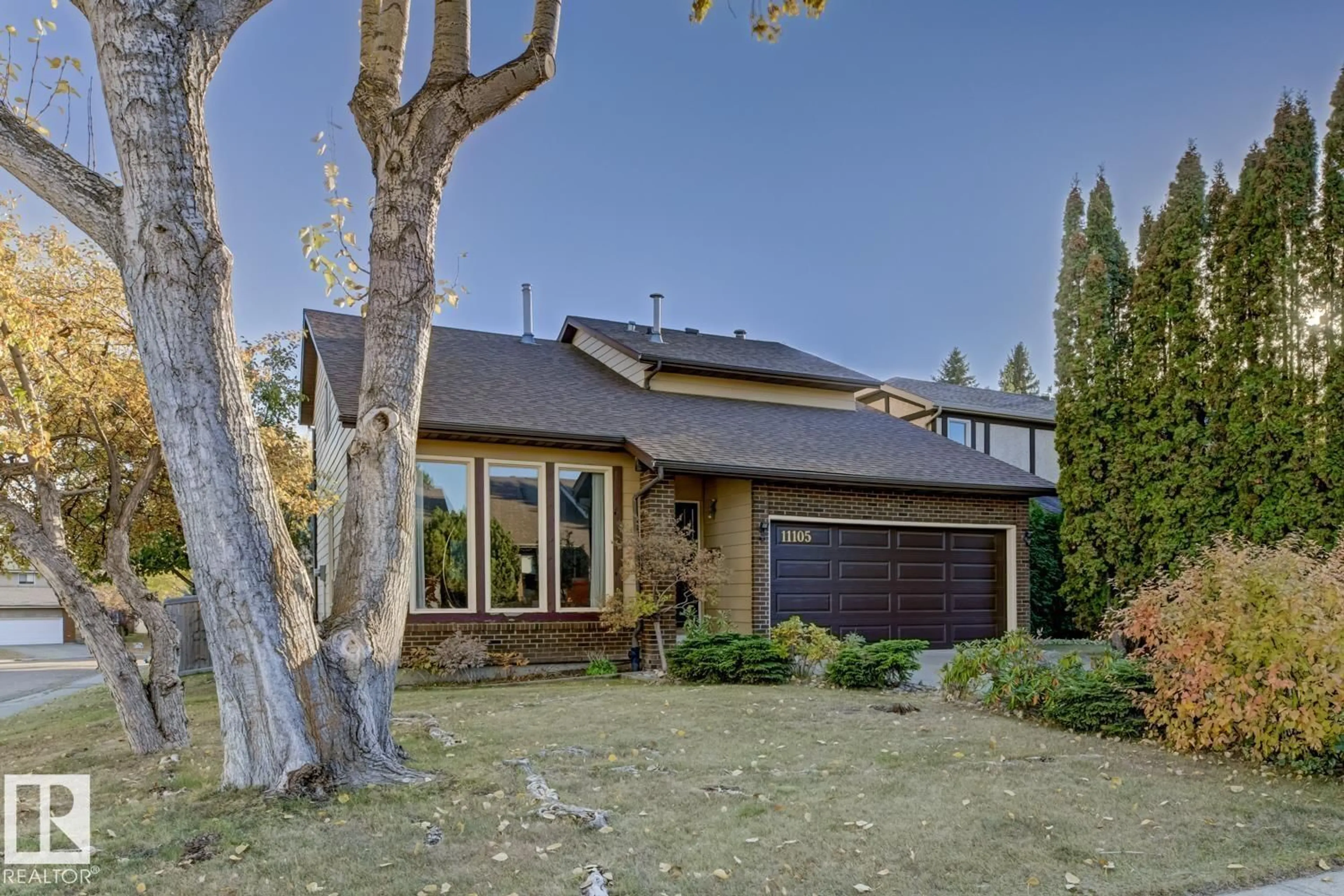 Home with brick exterior material, street for 11105 20 AV, Edmonton Alberta T6J4S6