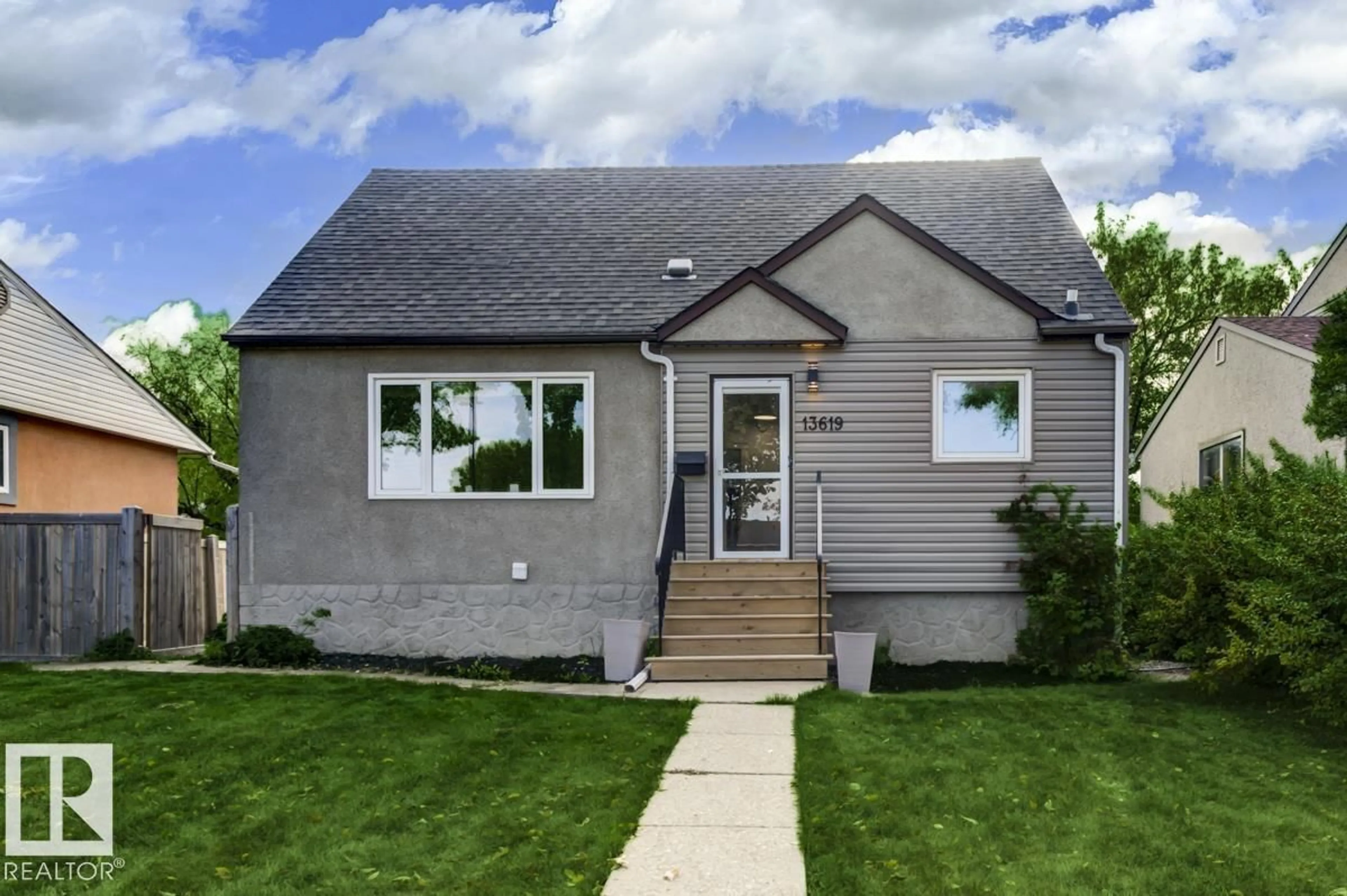 Home with vinyl exterior material, street for 13619 122 AV, Edmonton Alberta T5L2W1