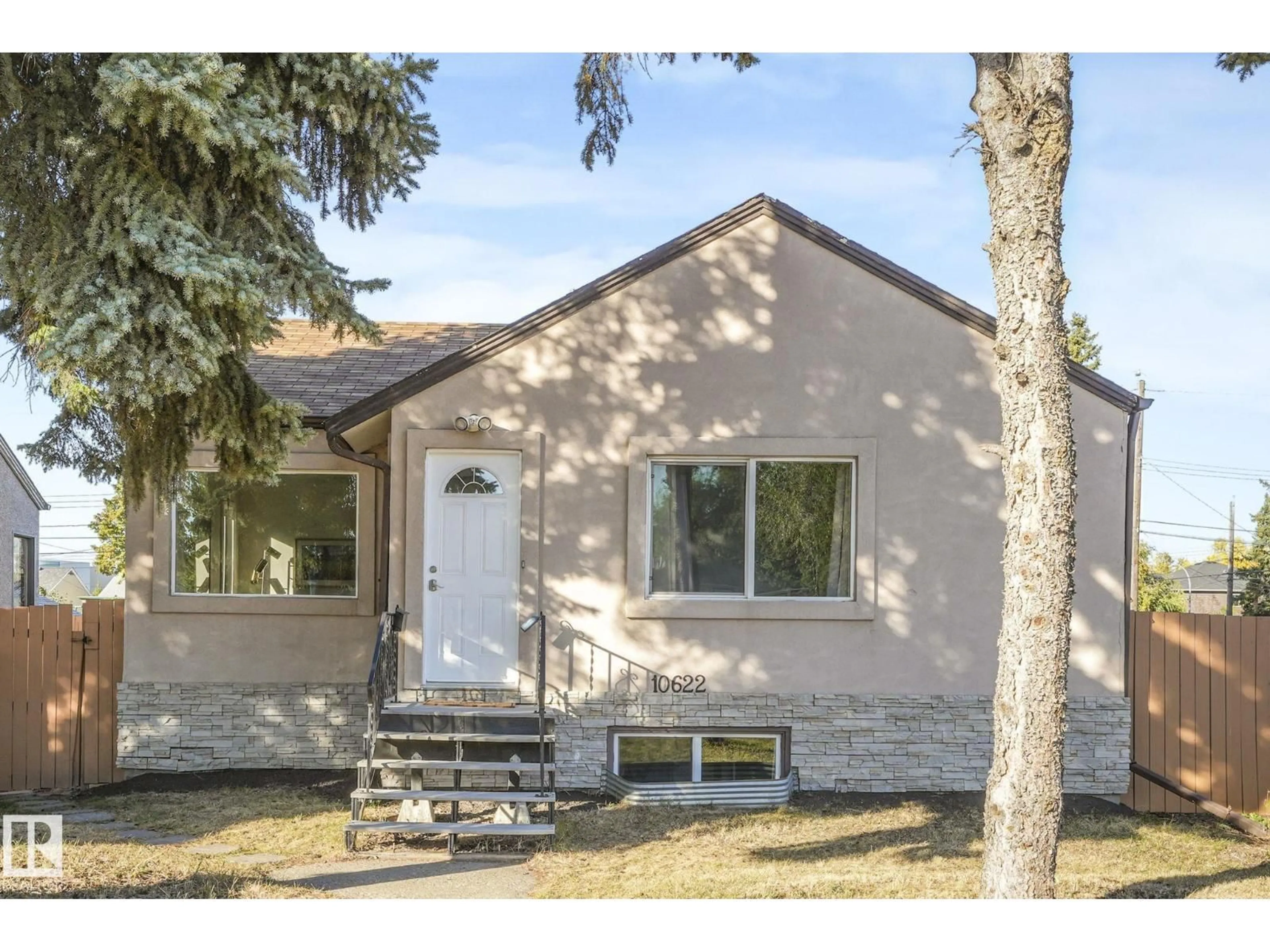 Home with vinyl exterior material, street for 10622 61 AV, Edmonton Alberta T6H1L7