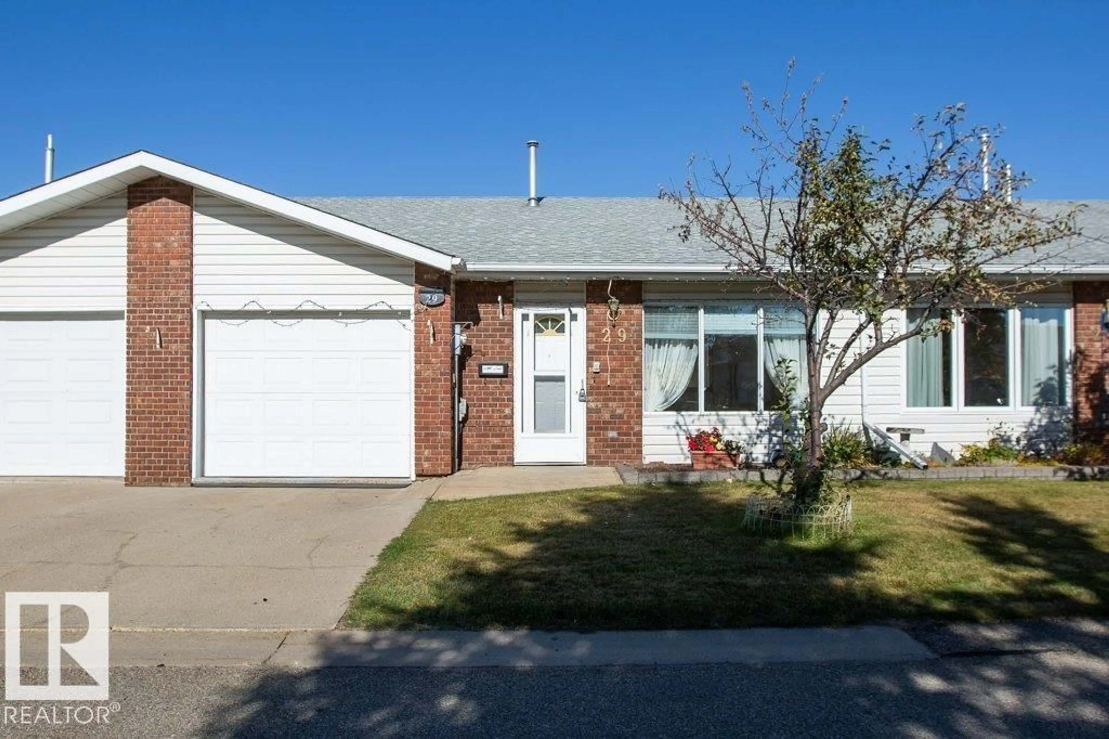 Home with vinyl exterior material, street for 29 11015 105 ST, Westlock Alberta T7P1A1