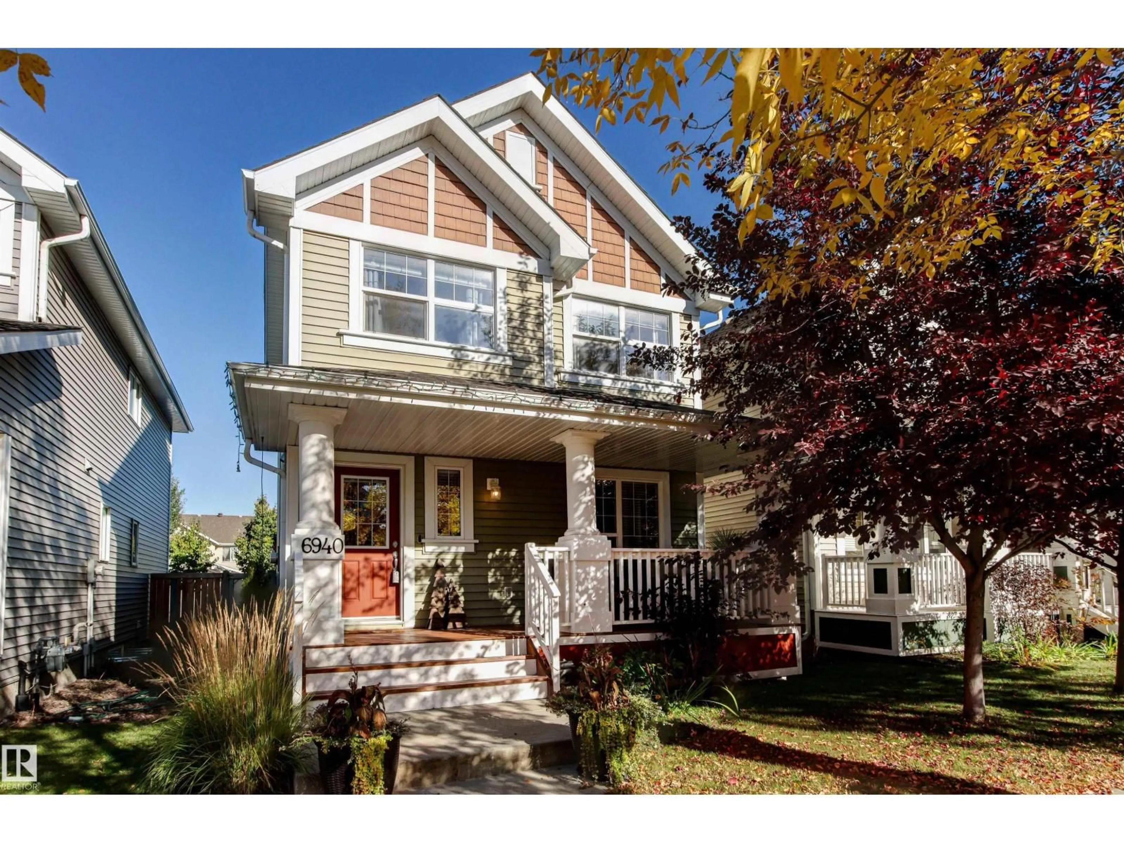 Home with vinyl exterior material, street for 6940 22 AV, Edmonton Alberta T6X0V4