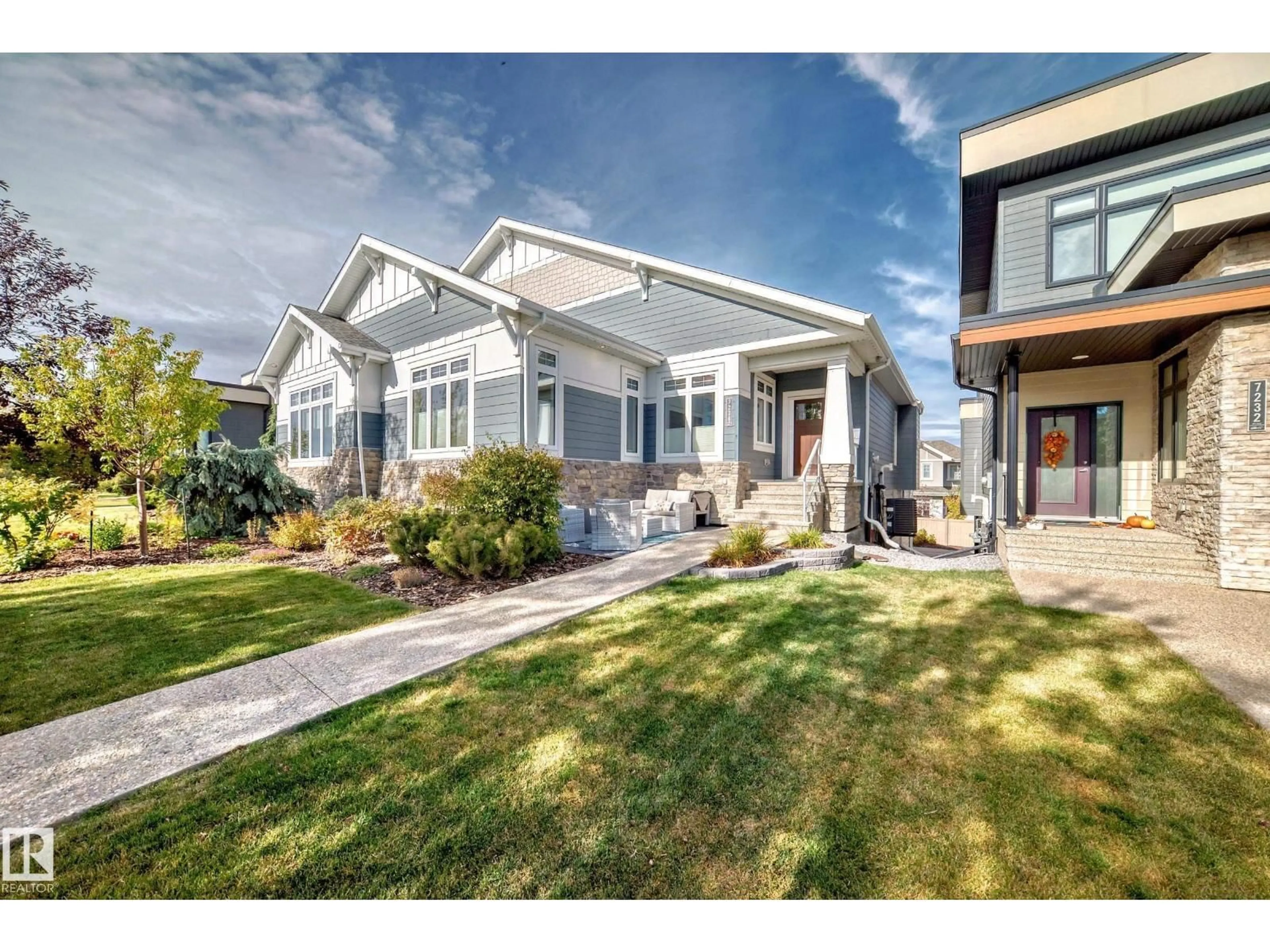 Home with vinyl exterior material, street for 7236 MAY RD, Edmonton Alberta T6R0T2