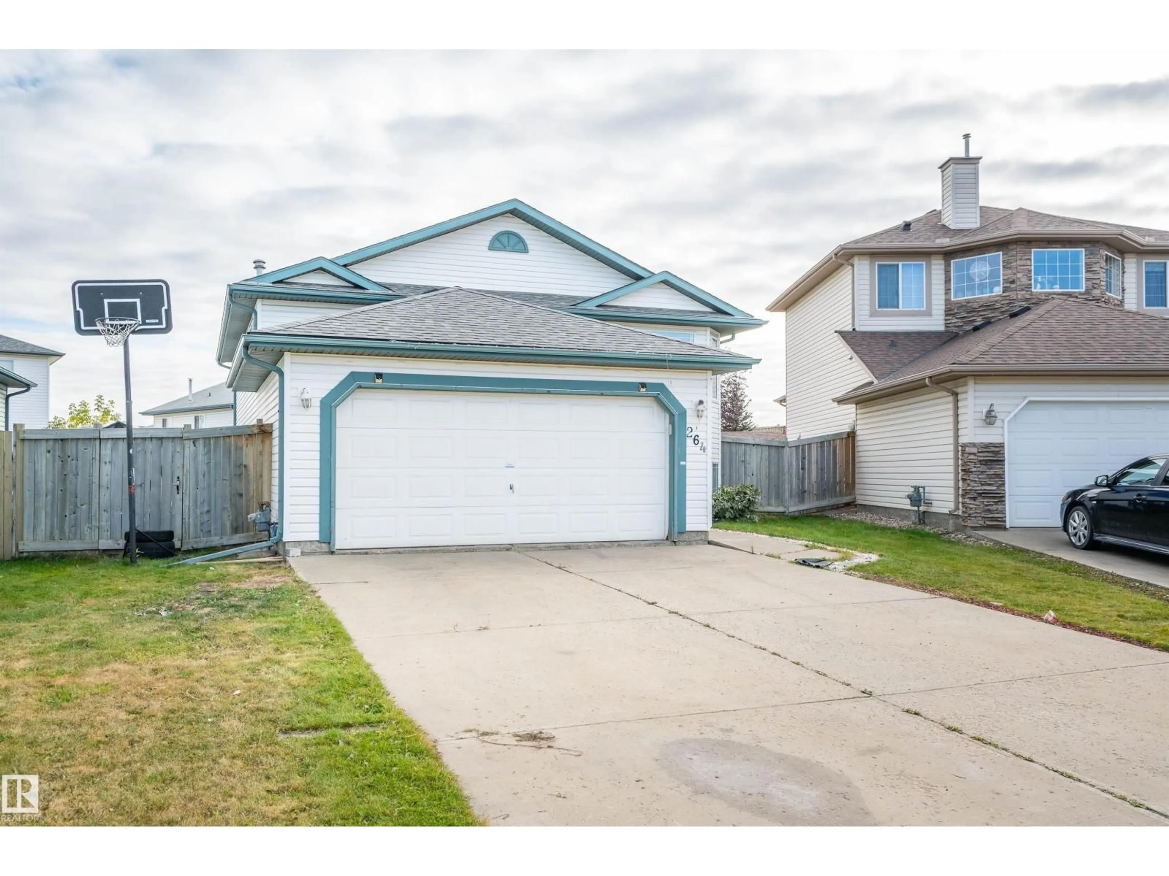 Home with vinyl exterior material, street for 264 DUNVEGAN RD, Edmonton Alberta T5L5E5