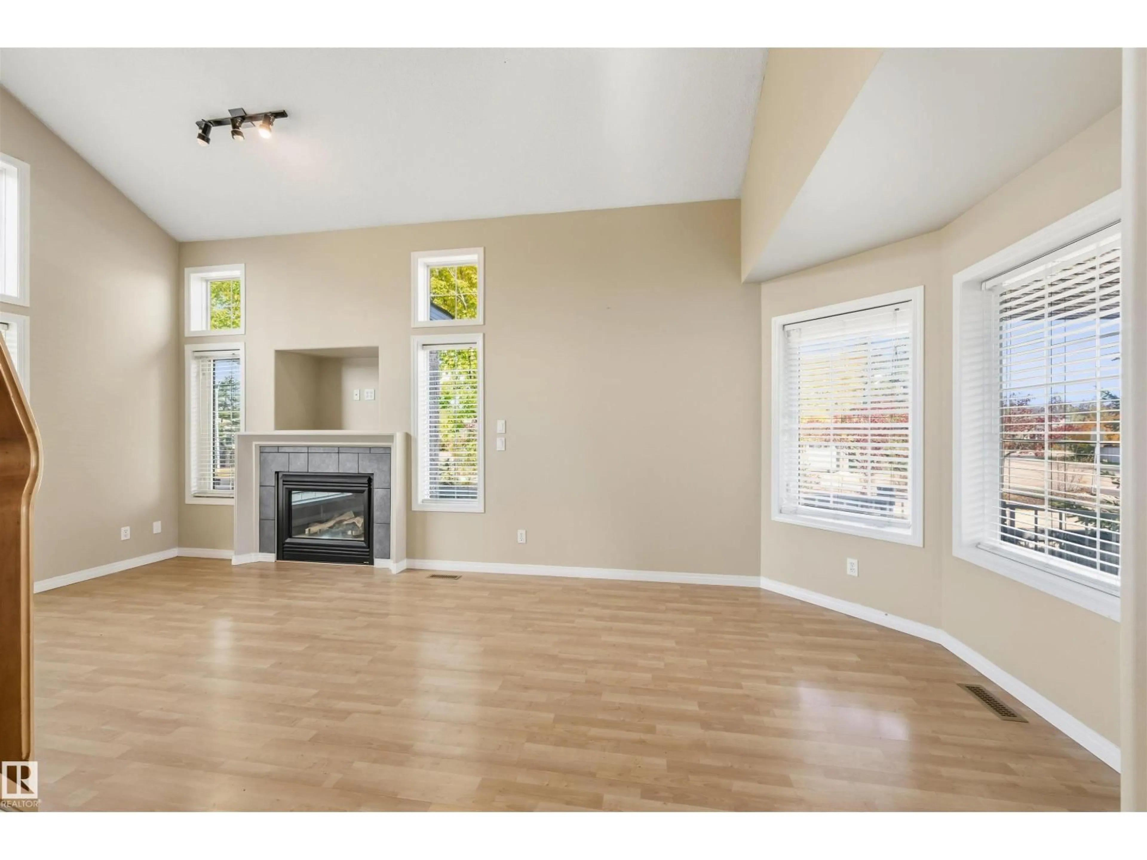 Living room with furniture, wood/laminate floor for 1324 FALCONER RD, Edmonton Alberta T6R2V5