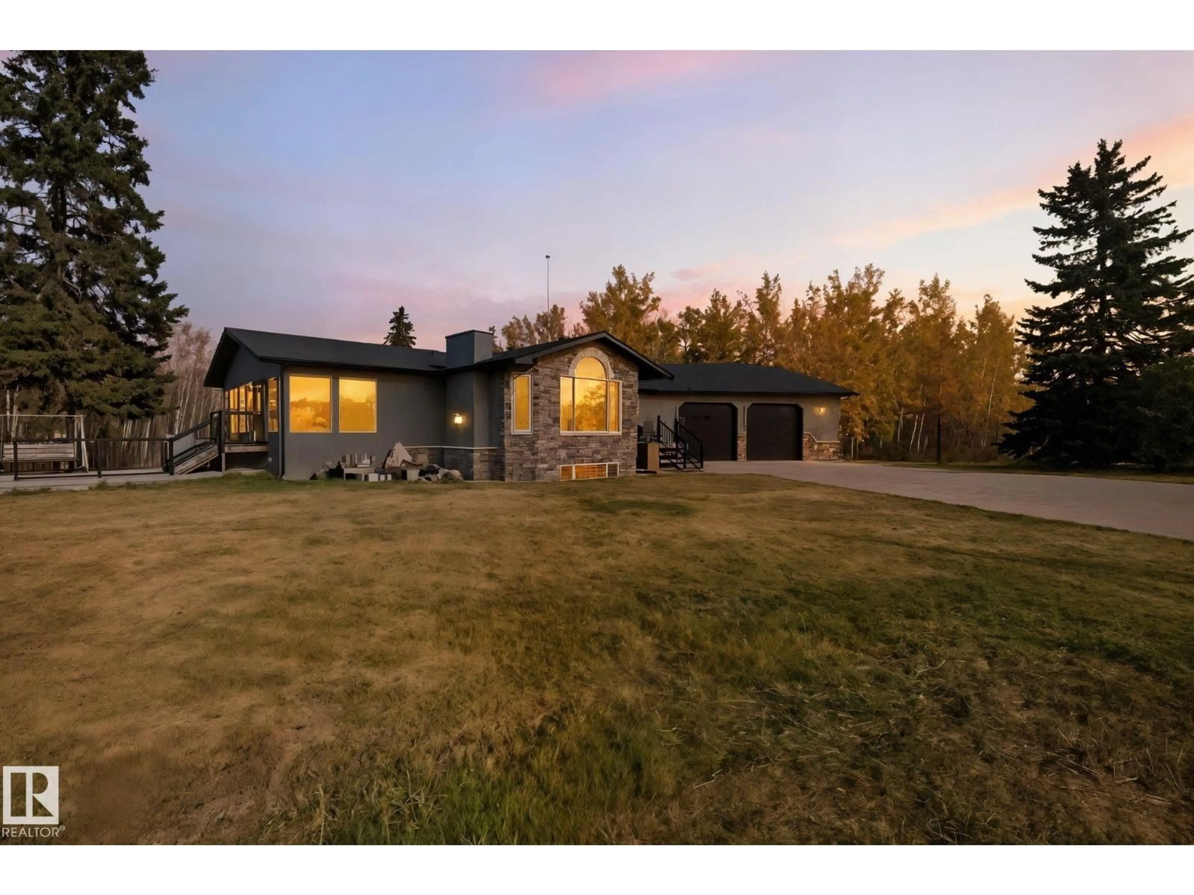 A pic from outside/outdoor area/front of a property/back of a property/a pic from drone, unknown for 22516 TWP ROAD 572, Rural Sturgeon County Alberta T0A1N5