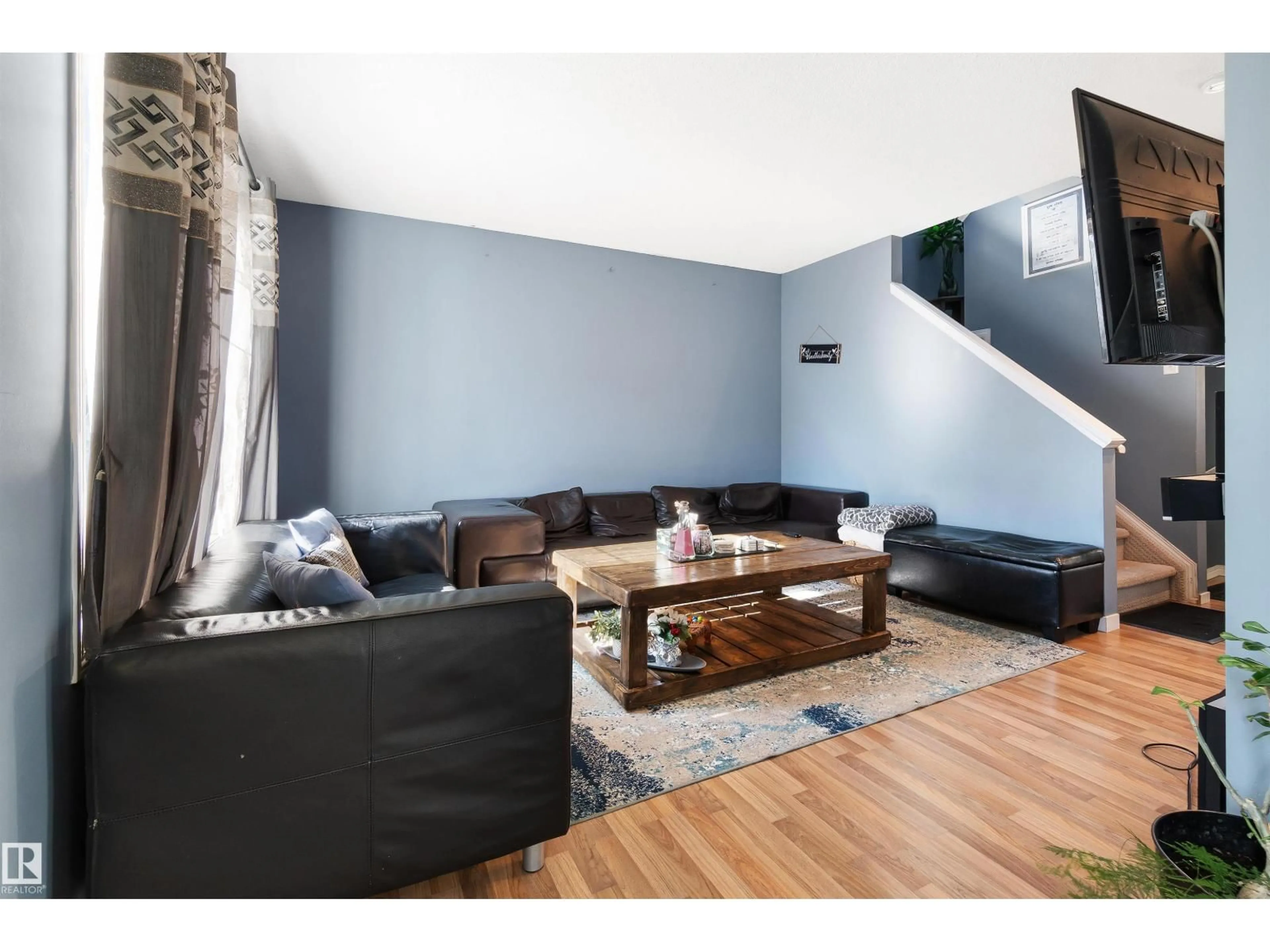 Living room with furniture, wood/laminate floor for #36 - 2503 24 ST, Edmonton Alberta T6T0B5