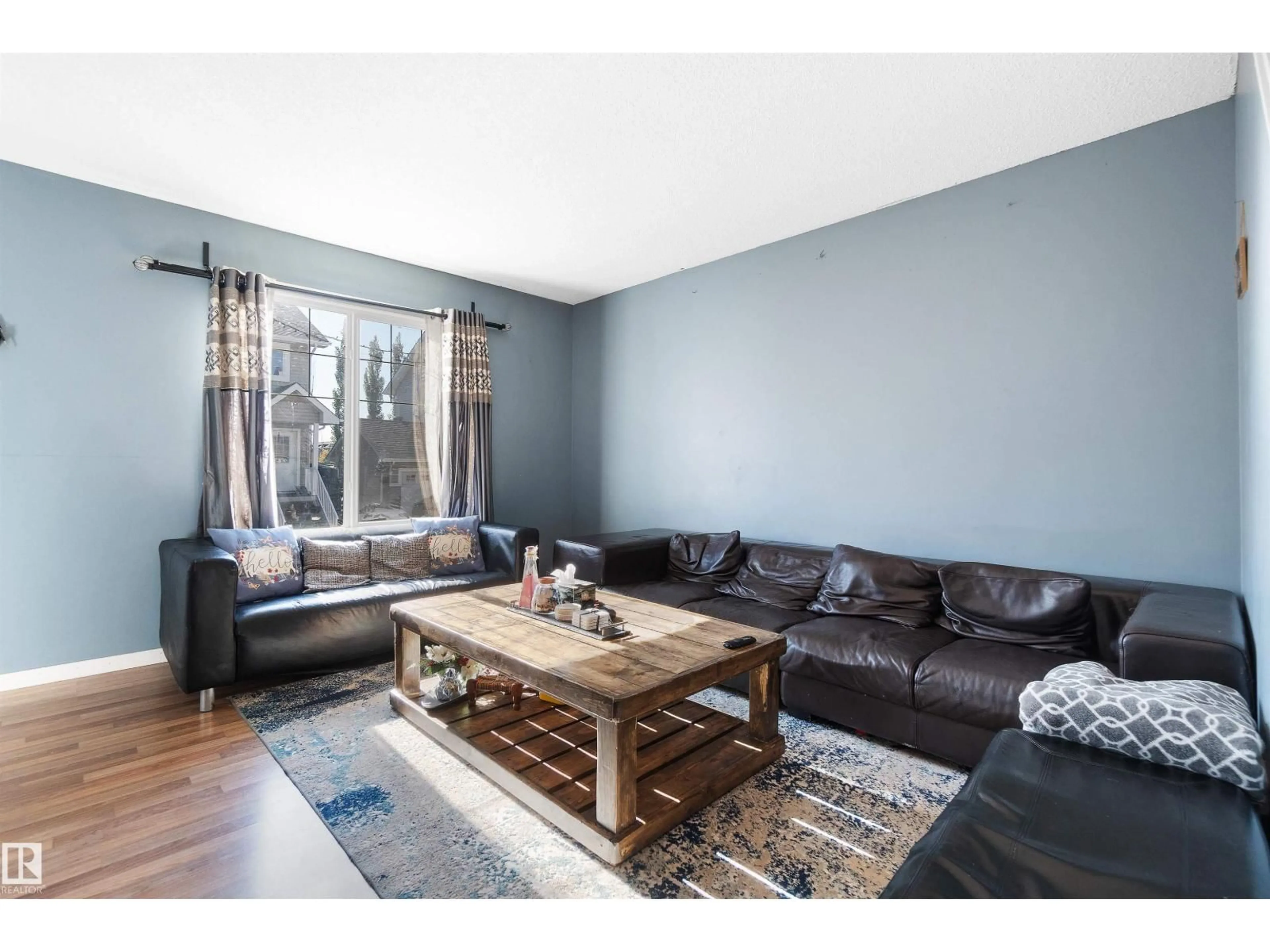 Living room with furniture, wood/laminate floor for #36 - 2503 24 ST, Edmonton Alberta T6T0B5