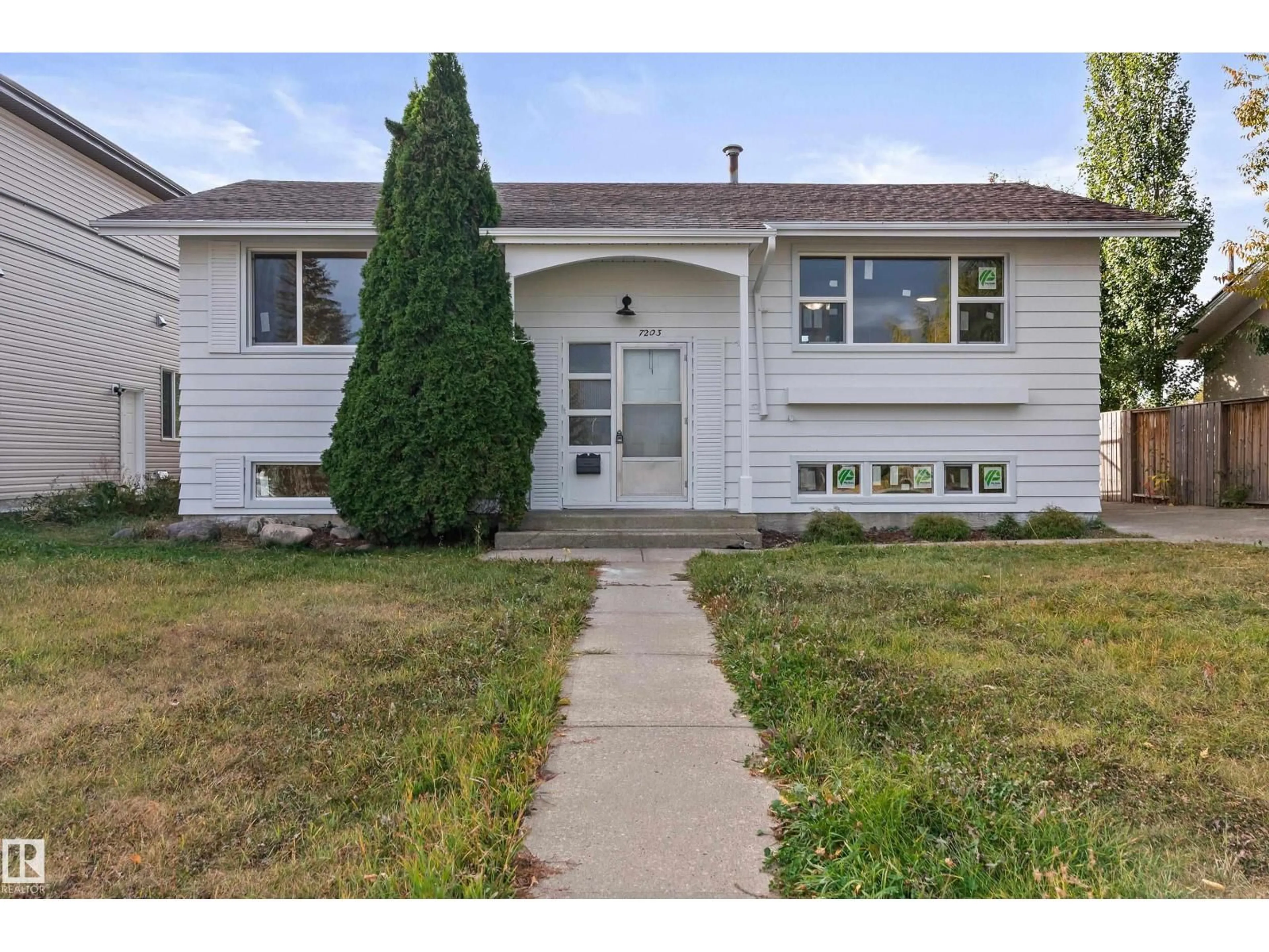 Home with vinyl exterior material, street for 7203 93 AV, Edmonton Alberta T6B1B2