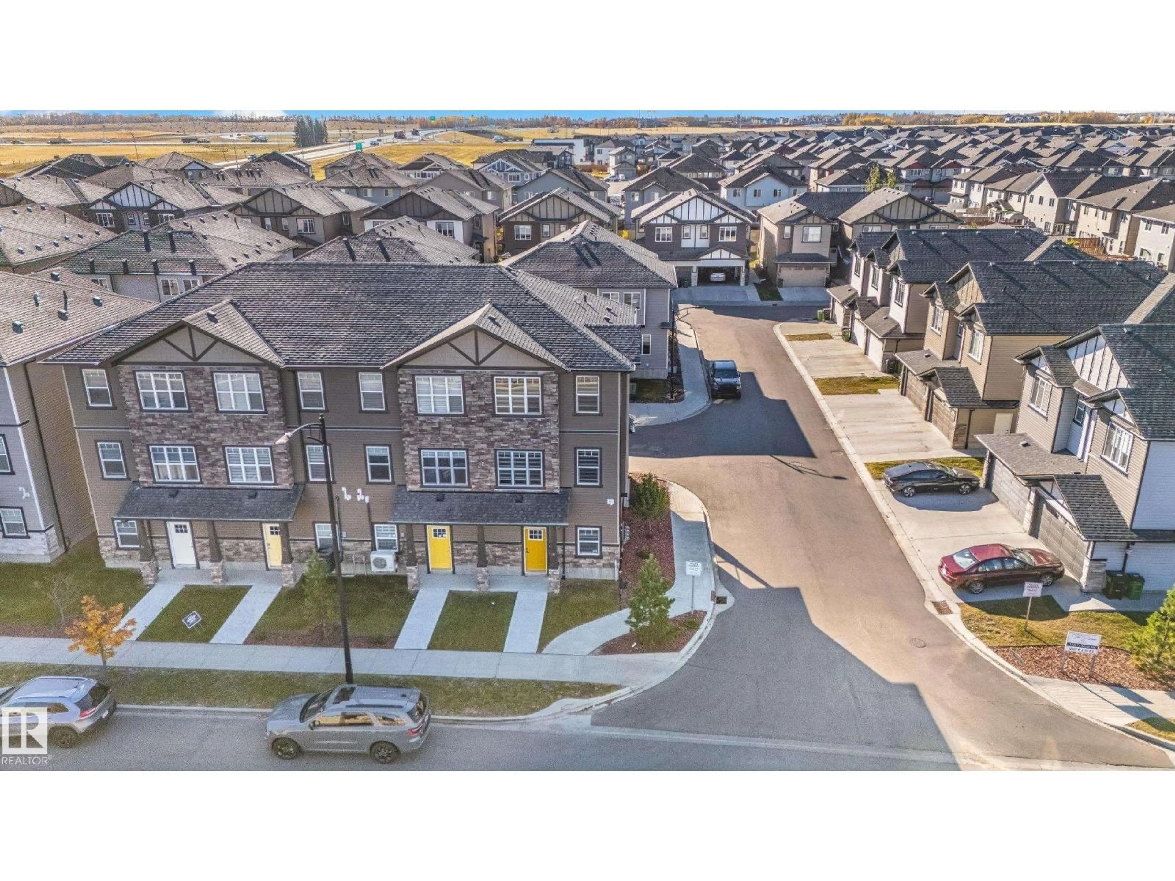 A pic from outside/outdoor area/front of a property/back of a property/a pic from drone, street for 19 - 1703 16 AV NW, Edmonton Alberta T6T2C3