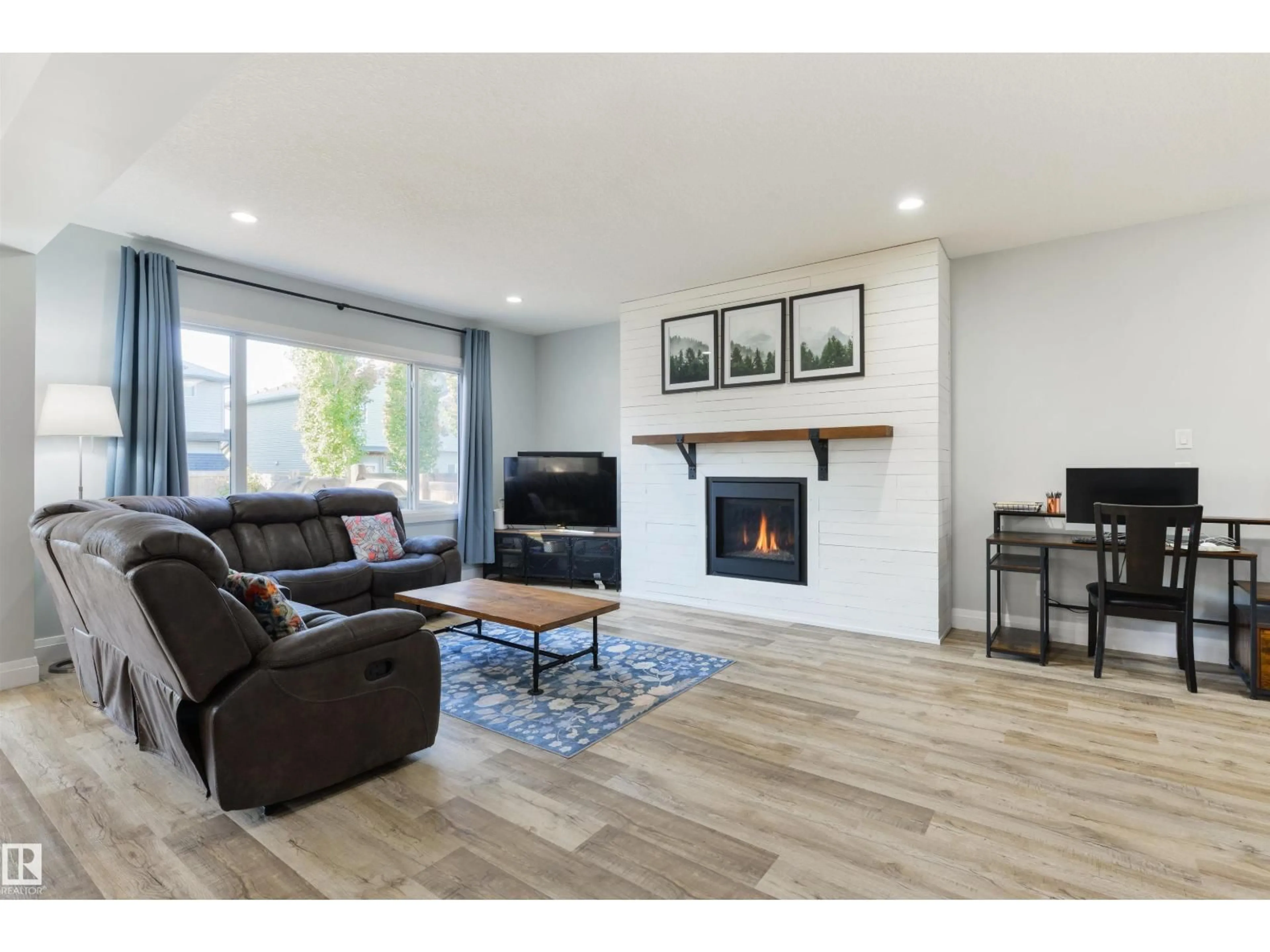 Living room with furniture, wood/laminate floor for 1024 SOUTH CREEK WD, Stony Plain Alberta T7Z0C9