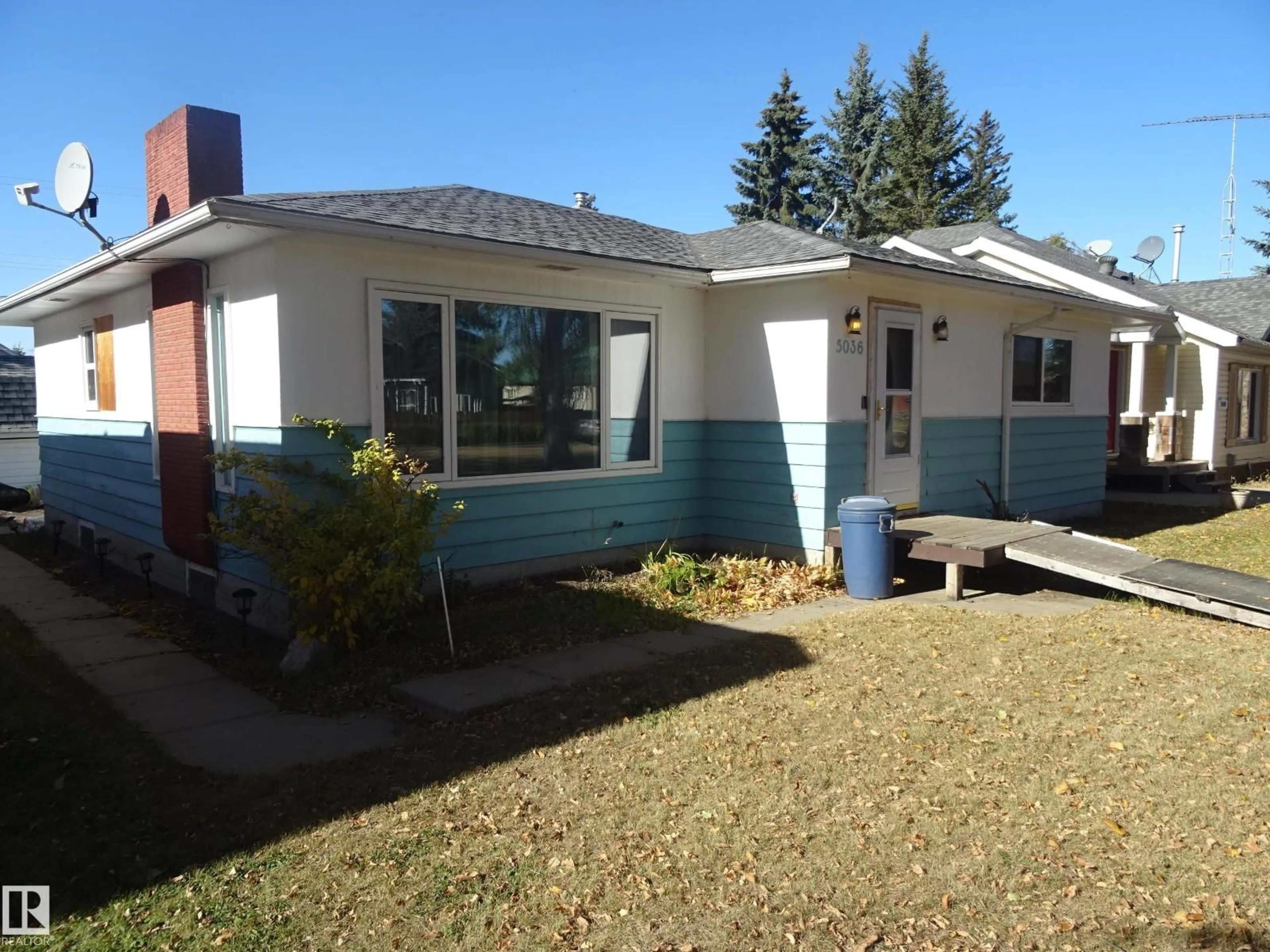 Home with vinyl exterior material, street for 5036 52 ST, Andrew Alberta T0B0C0
