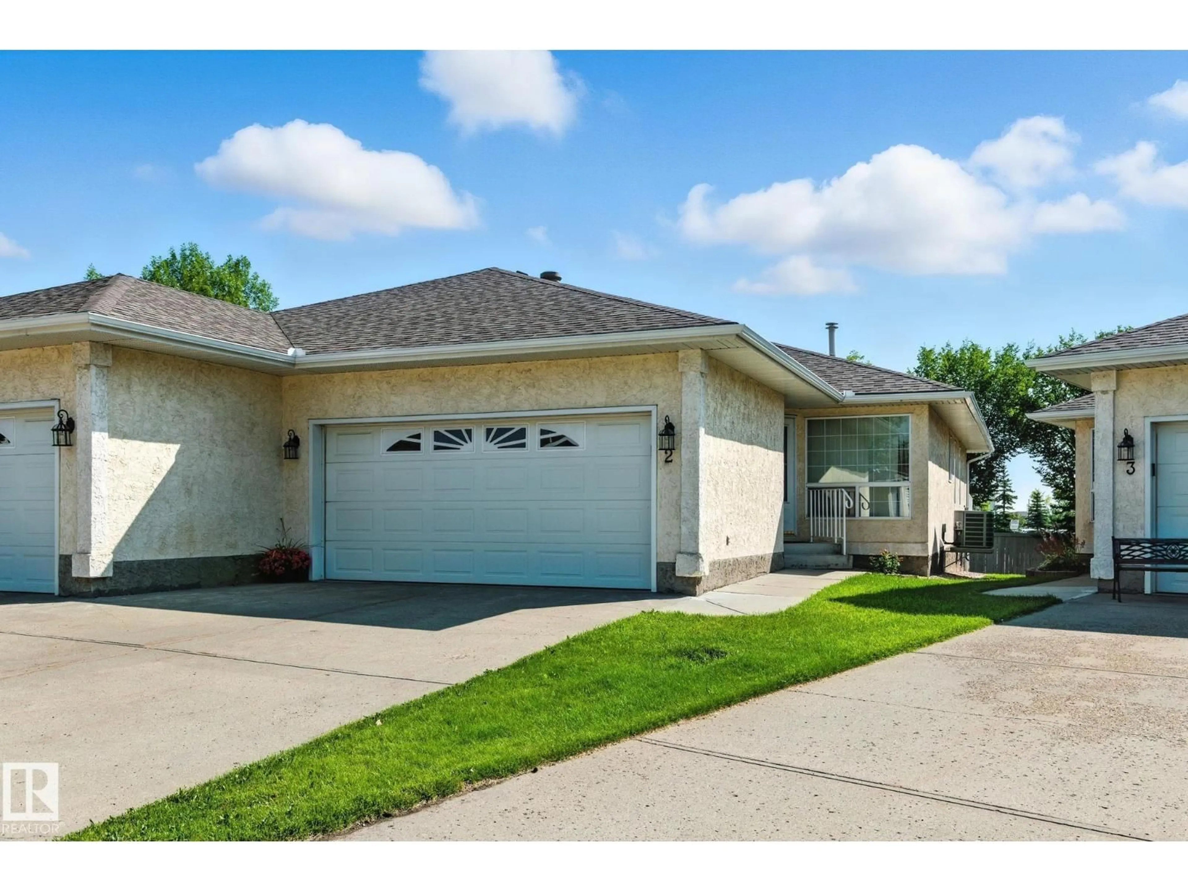 Home with vinyl exterior material, street for #2 - 14428 MILLER BLVD, Edmonton Alberta T5Y2Y6