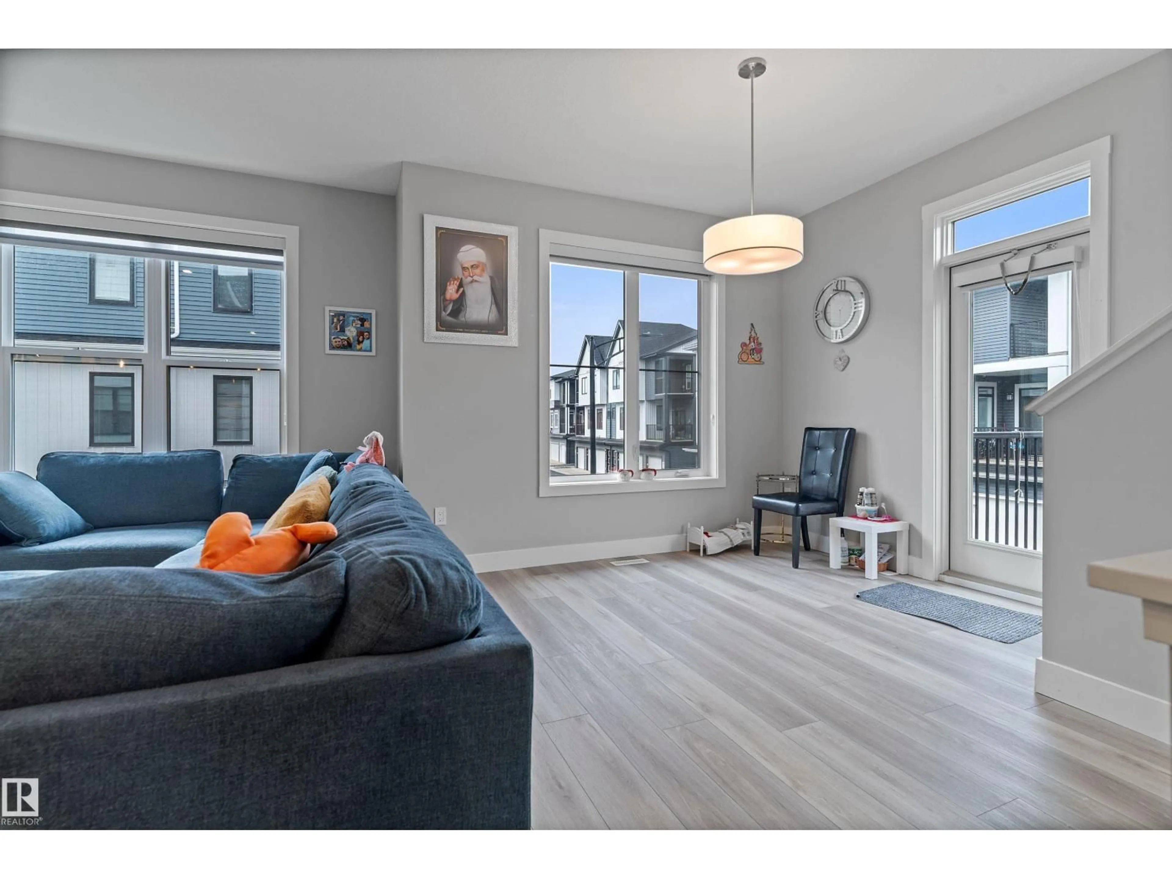 Living room with furniture, wood/laminate floor for #70 - 6905 25 AV, Edmonton Alberta T6X3B7