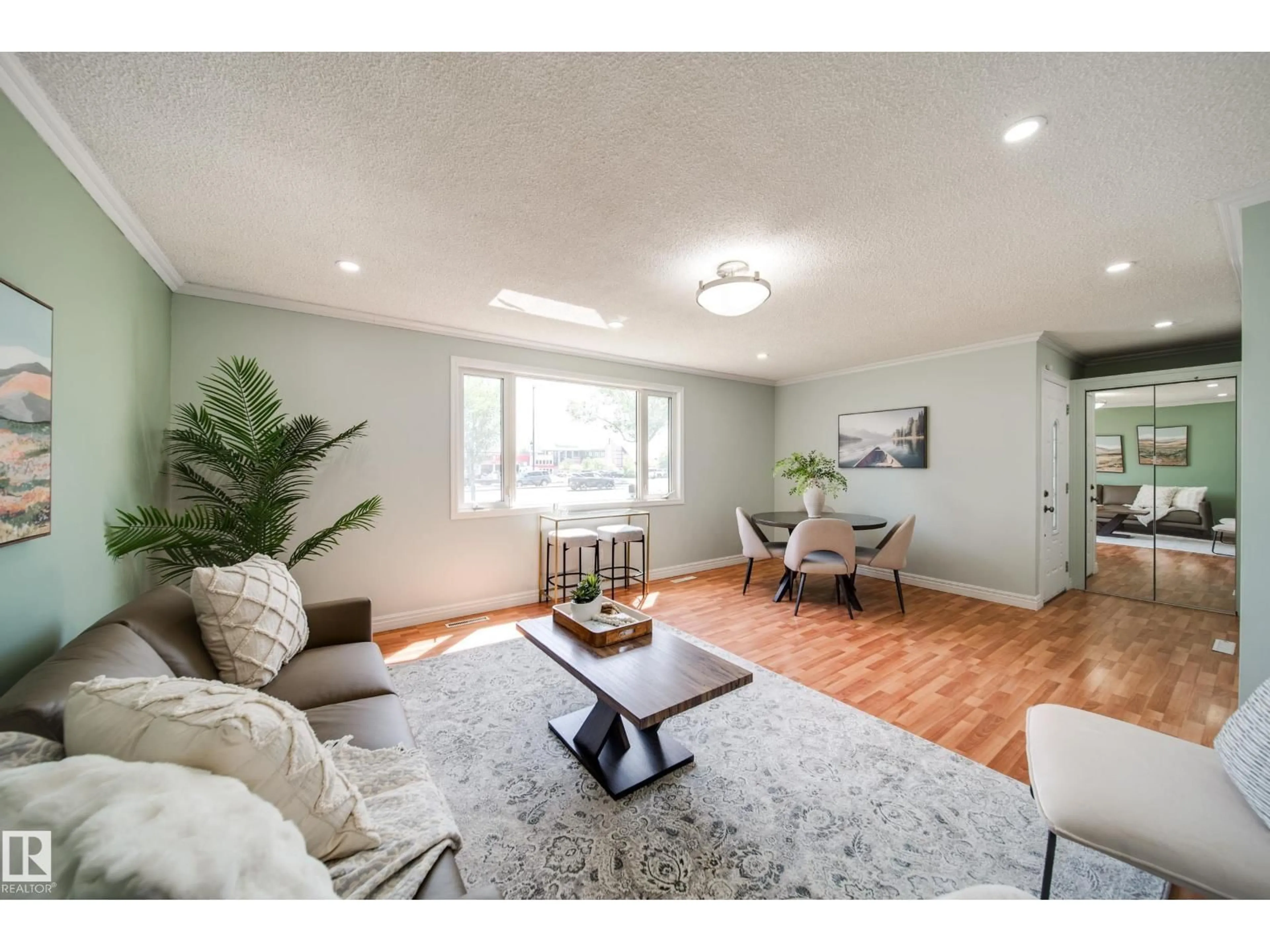 Living room with furniture, wood/laminate floor for 13004 FORT RD, Edmonton Alberta T5A1B8