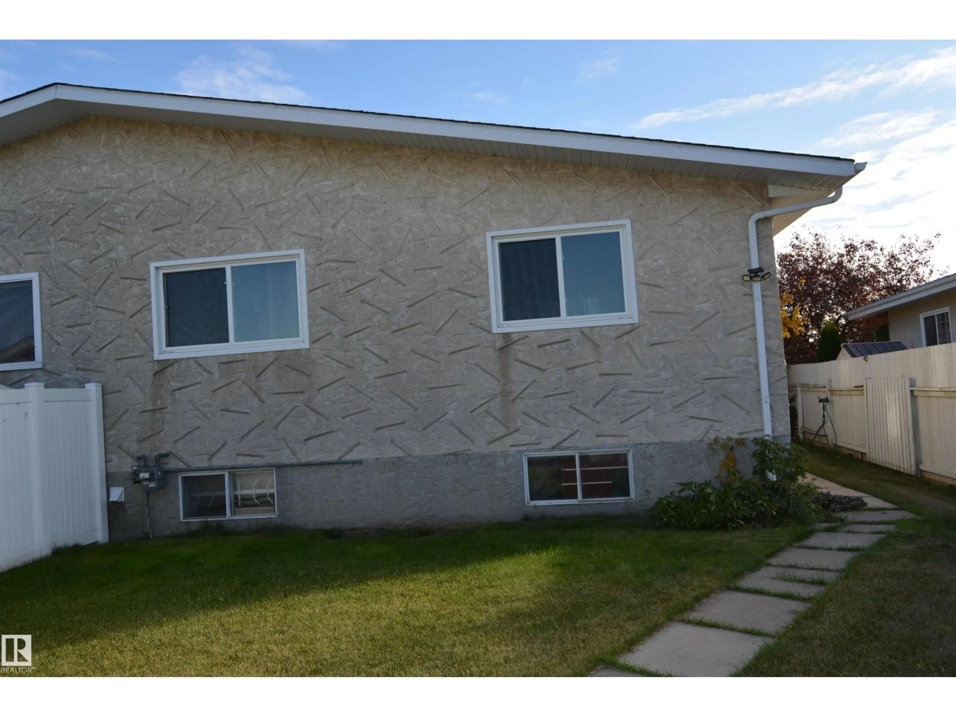 Home with vinyl exterior material, street for 132 MILLBOURNE RD E, Edmonton Alberta T6K0K9