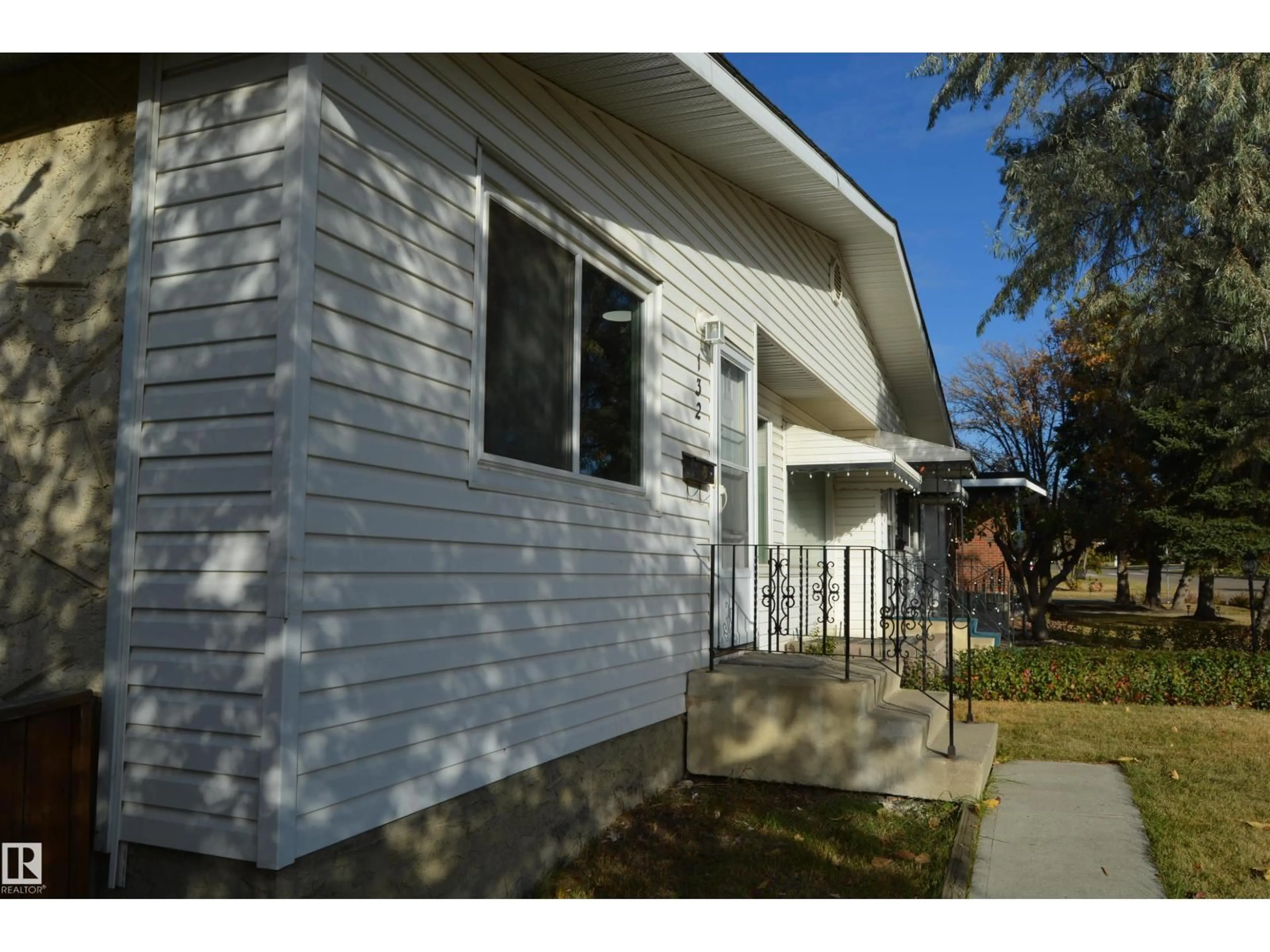 Home with vinyl exterior material, street for 132 MILLBOURNE RD E, Edmonton Alberta T6K0K9