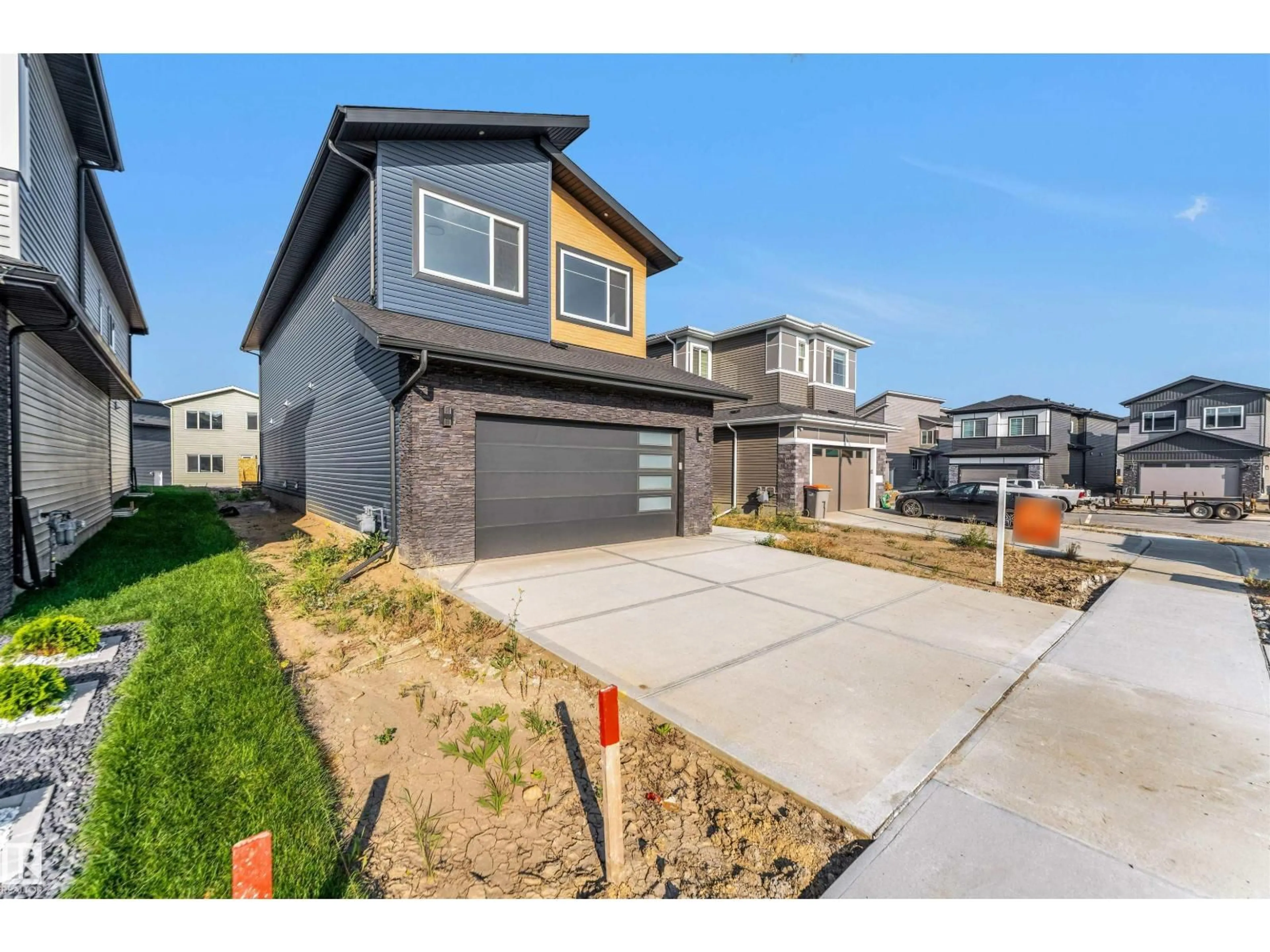 Home with brick exterior material, street for NE - 6226 19 ST, Rural Leduc County Alberta T4X3C8