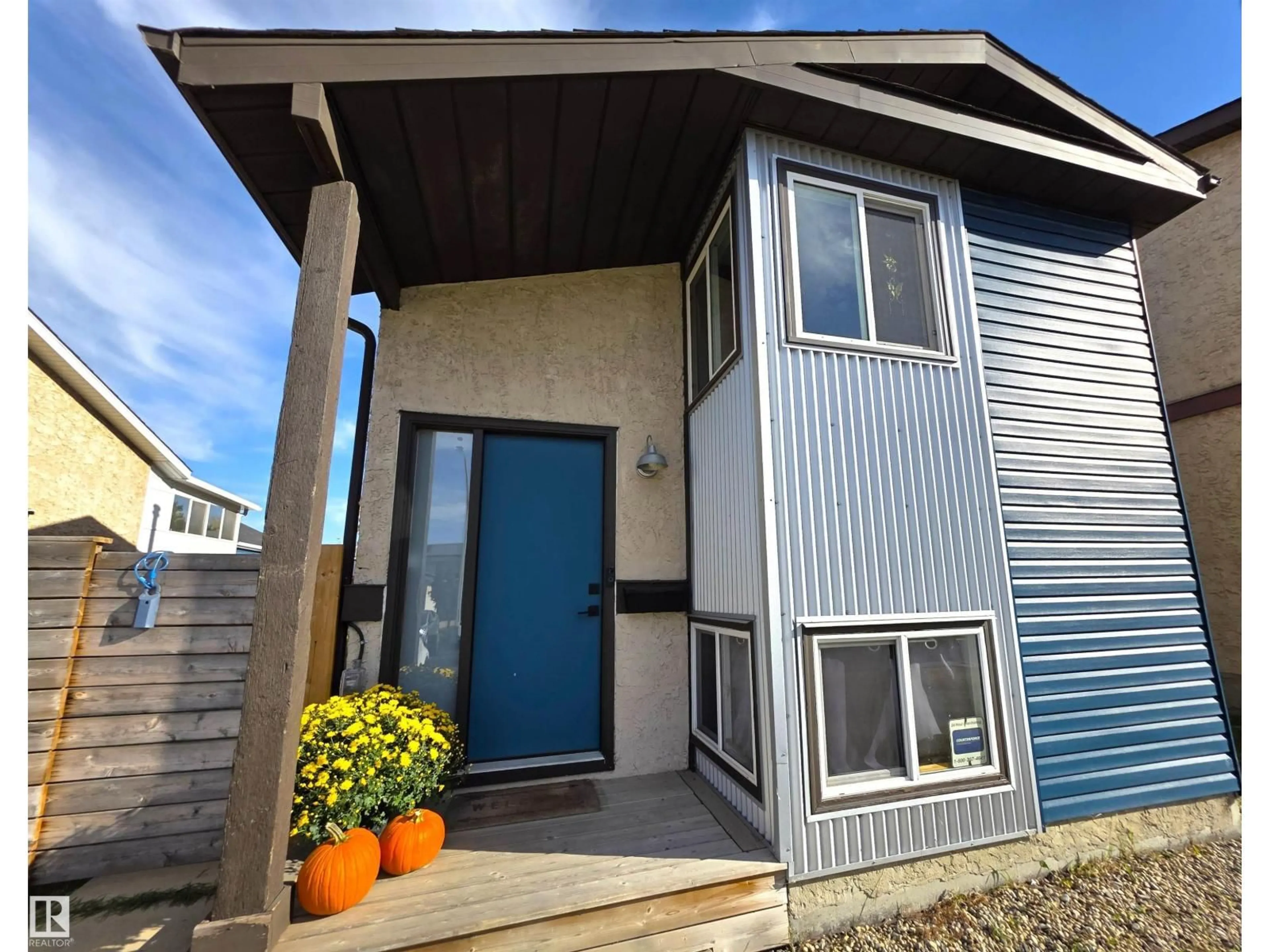 Home with vinyl exterior material, street for NW - 14743 33 ST, Edmonton Alberta T5Y2C9