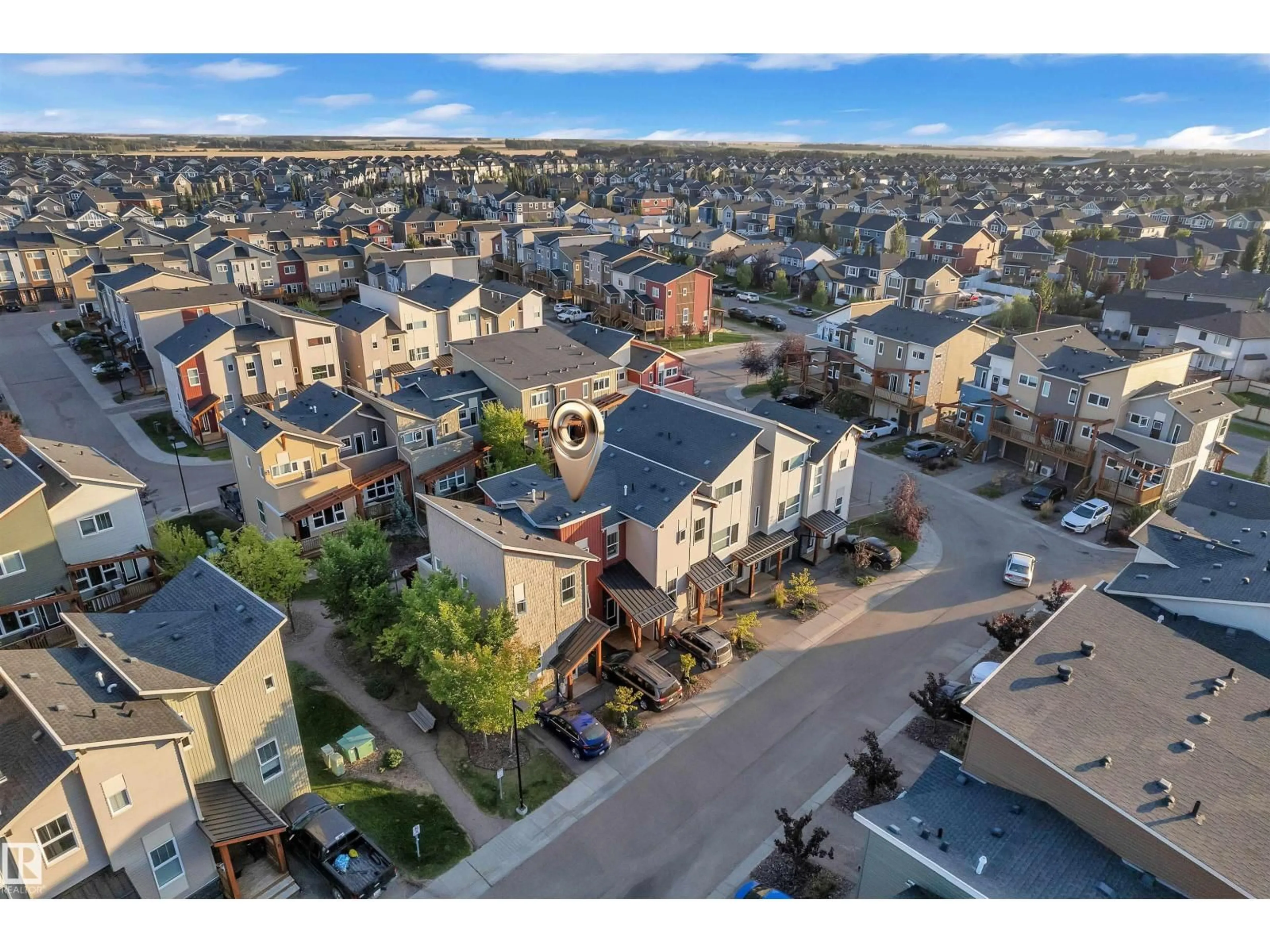 A pic from outside/outdoor area/front of a property/back of a property/a pic from drone, street for 401 - 153 SOUTHFORK DR, Leduc Alberta T9E0X1