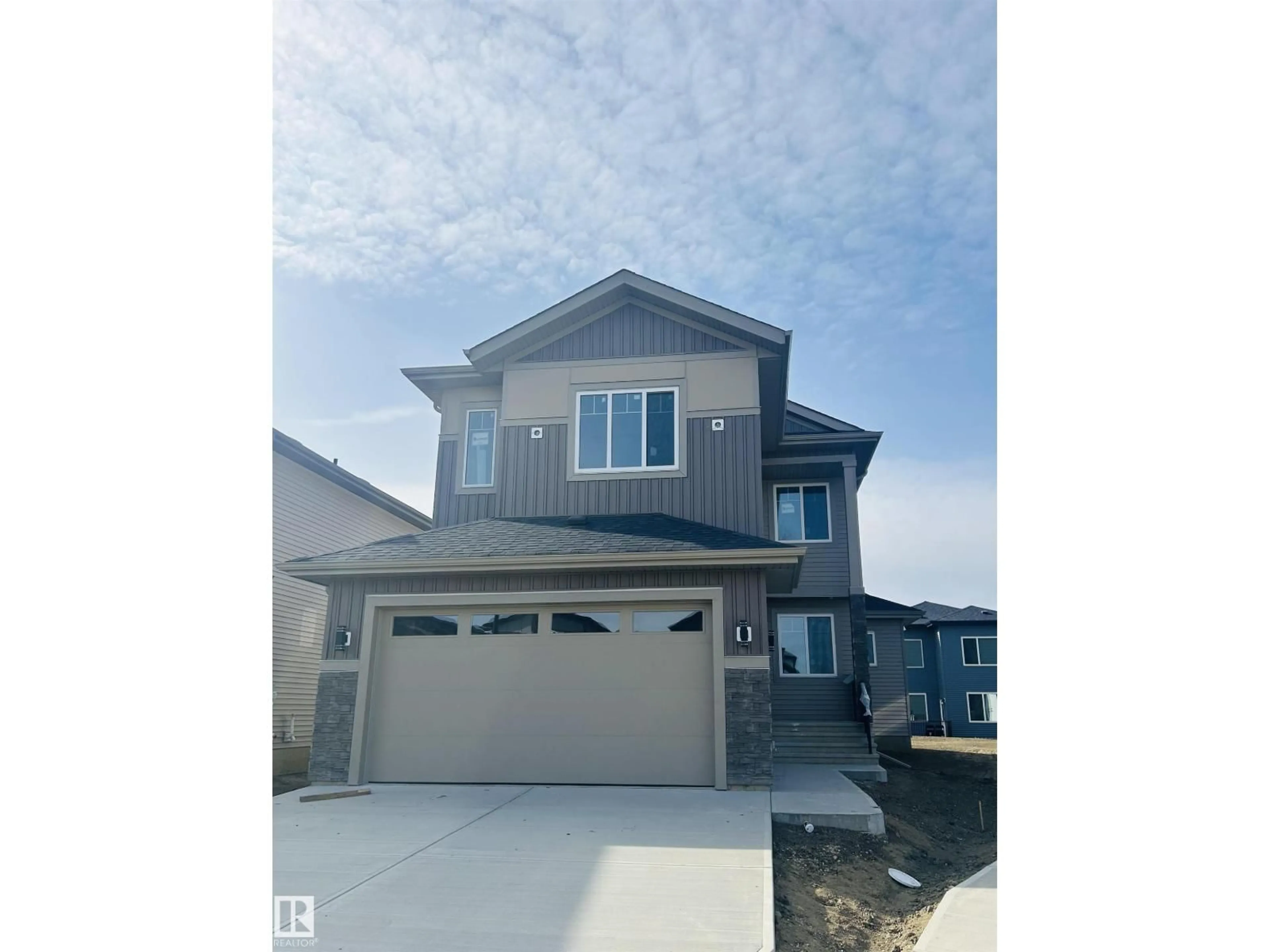 Home with vinyl exterior material, street for NE - 5924 18 ST, Rural Leduc County Alberta T4X3C7