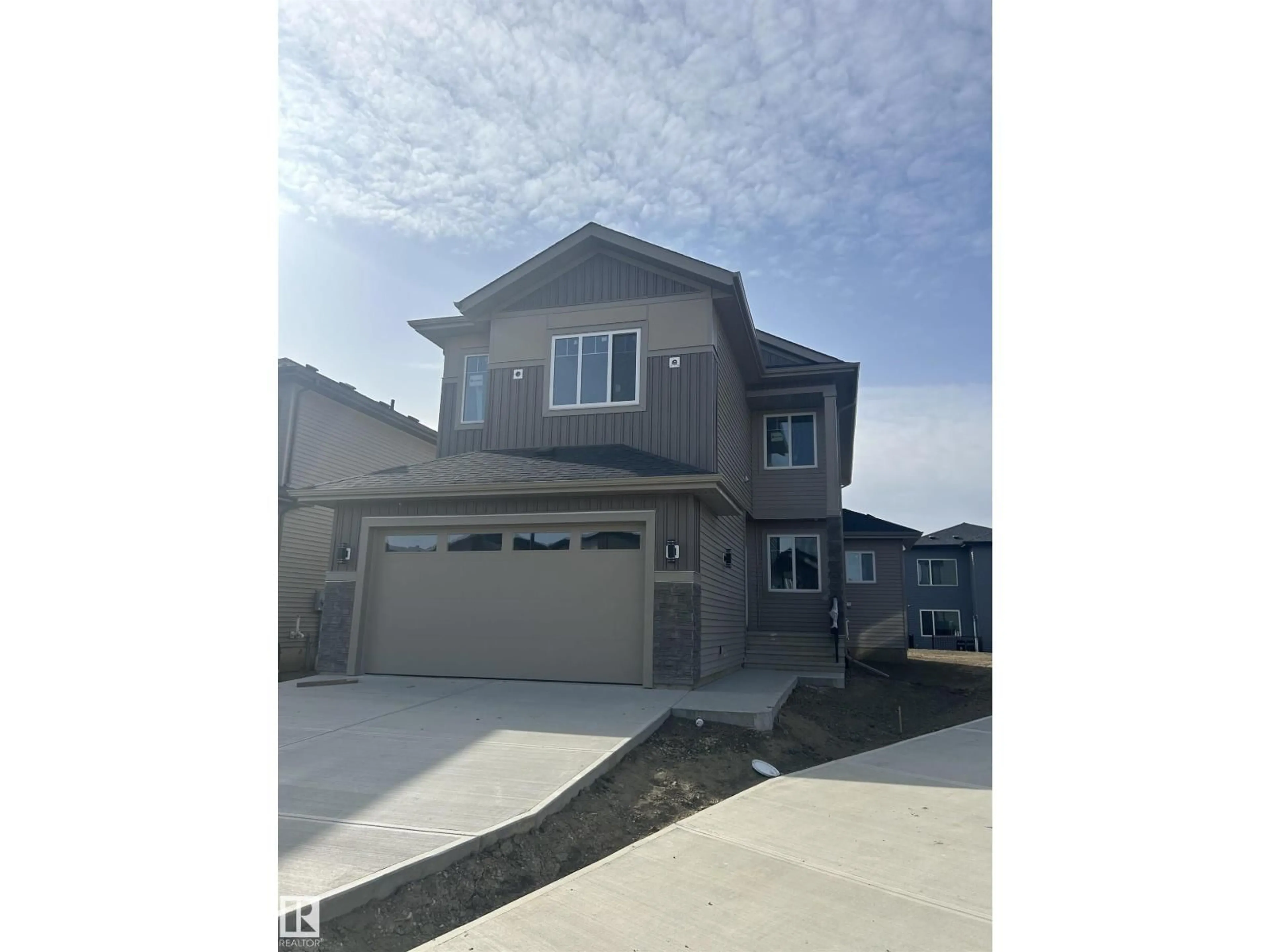 Home with vinyl exterior material, street for NE - 5924 18 ST, Rural Leduc County Alberta T4X3C7